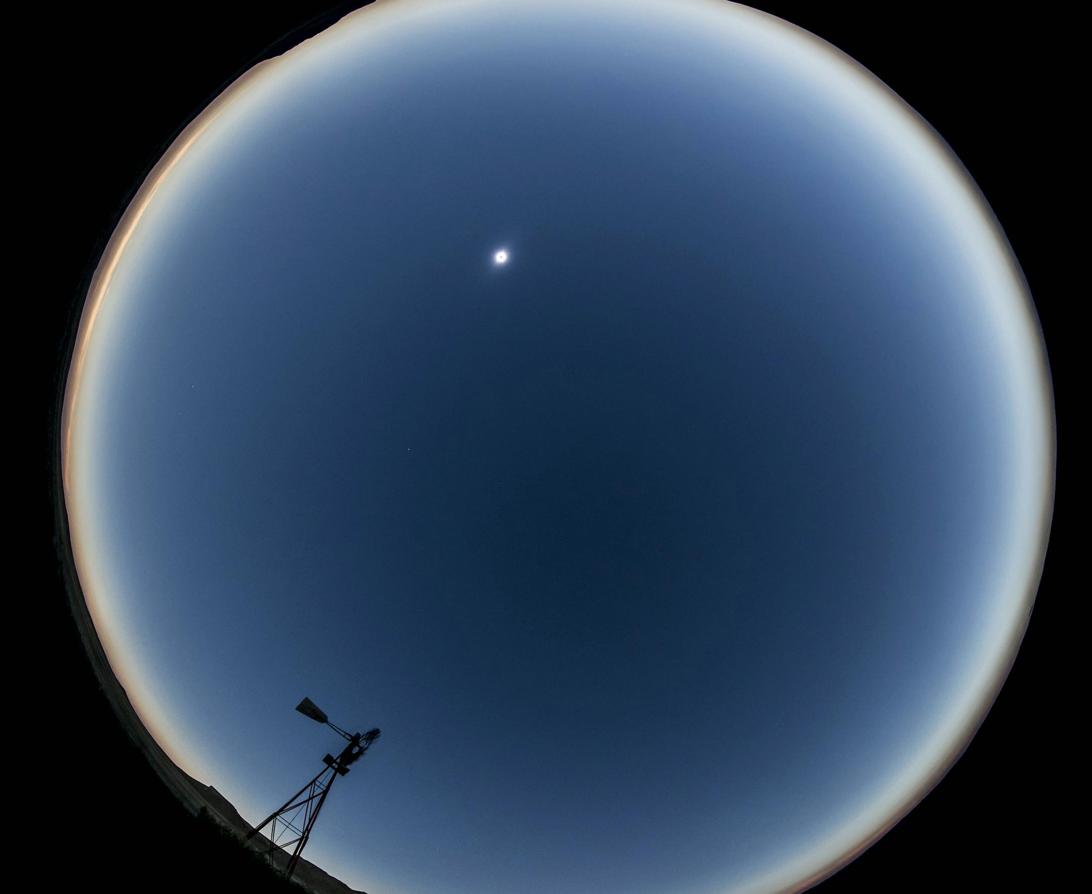 The Traveller: Carlton McMillan and Family of Lakeville The scene: The total eclipse as it raced across the skies of western Nebraska on the Wyoming border. The Trip: I had never witnessed a total eclipse but I remember the excitement from my youth when we had the partial eclipse. About a year ago I began researching where would be the best spots to view the total eclipse. Spending weeks looking at Google Earth images I picked several possible viewing spots along the path of totality figuring th
