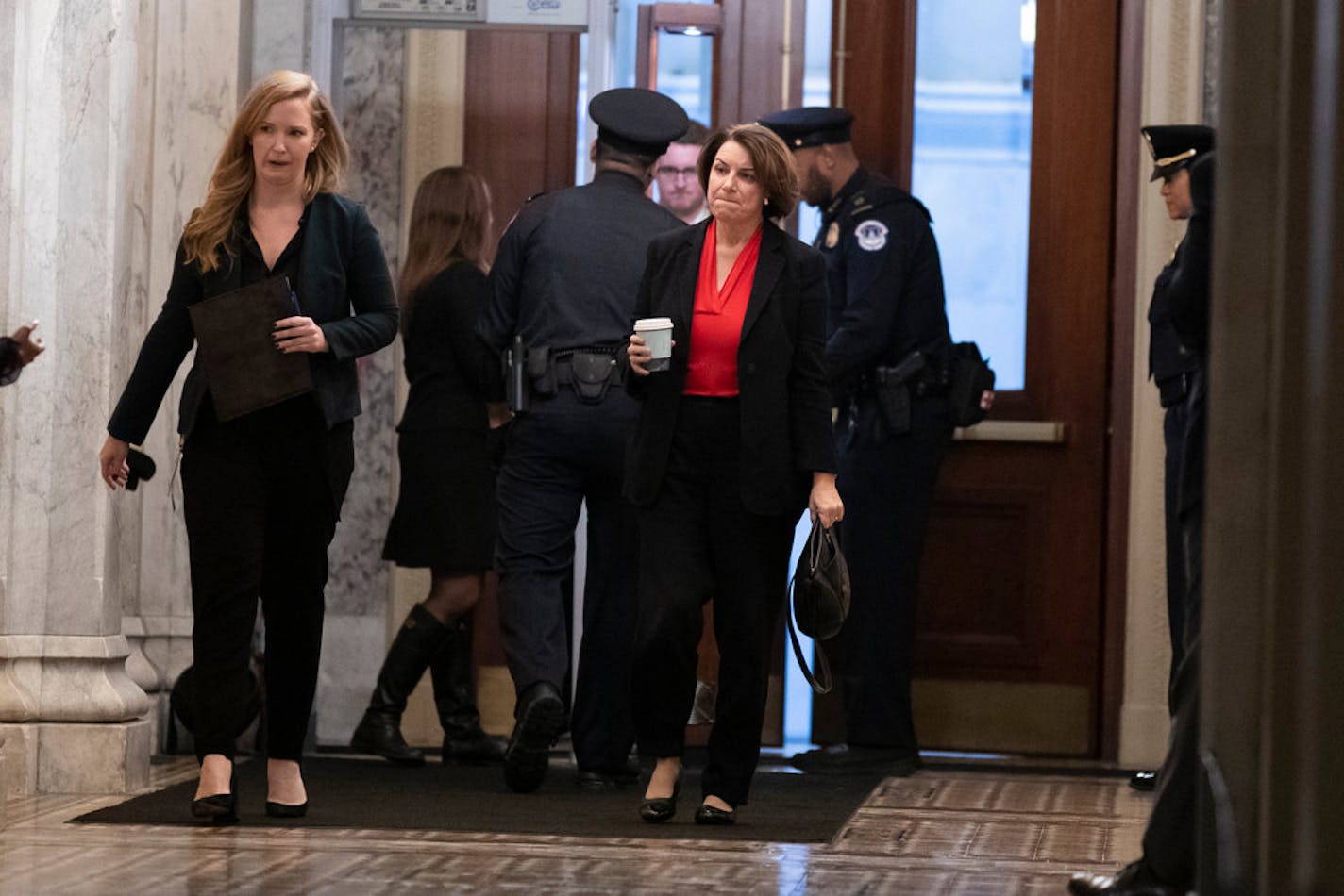 Sen. Amy Klobuchar, D-Minn., arrived on Capitol Hill before the impeachment votes Wednesday.