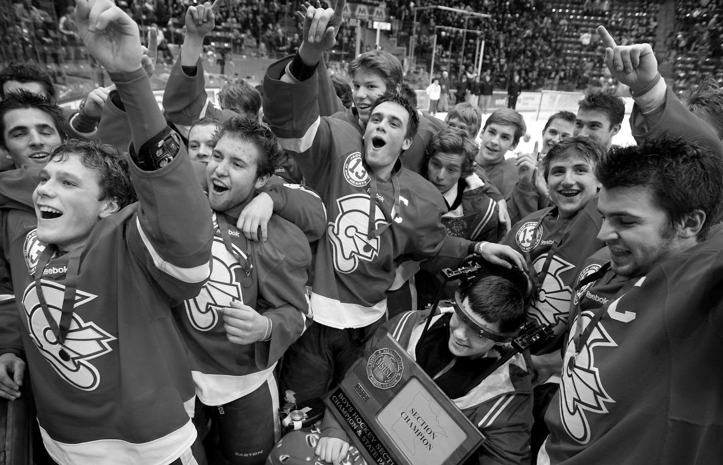 February 29, 2012 - Jack Jablonski and Benilde St. Margaret's teammates celebrated with their fans in the stands after BSM beat Minnetonka 5-1 in the Section 6AA championship game to advance to the State Tournament. ] CARLOS GONZALEZ cgonzalez@startribune.com, February 29, 2012, Mariucci Arena, Minneapolis, Minn, Jack Jablonski, Section 6AA championship game, Benilde St. Margaret's vs. Minnetonka, BSM beat Minnetonka 5-1.