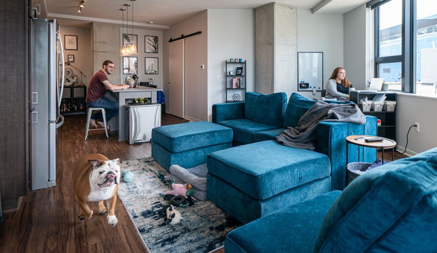 Alex and Paige Maslyn both work from their 1000 sq ft apartment on Washington Ave S, along with their two-year-old English Bulldog Boris. They just bought a house in SW Minneapolis for more space.