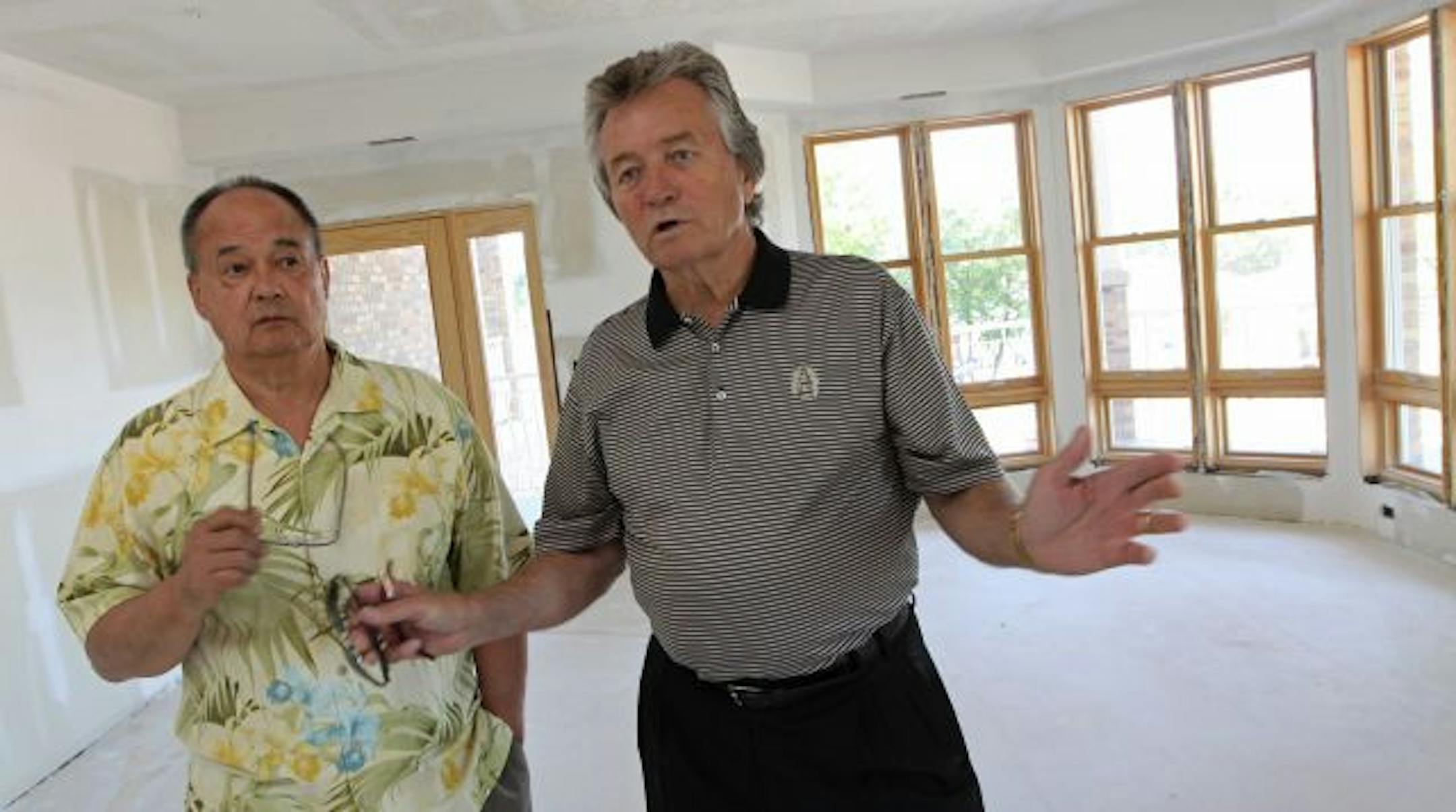 Ken Miyamoto, left, and Tom Meehan have had no success trying to give away an Eagles Point condo to a Minnesota veteran.