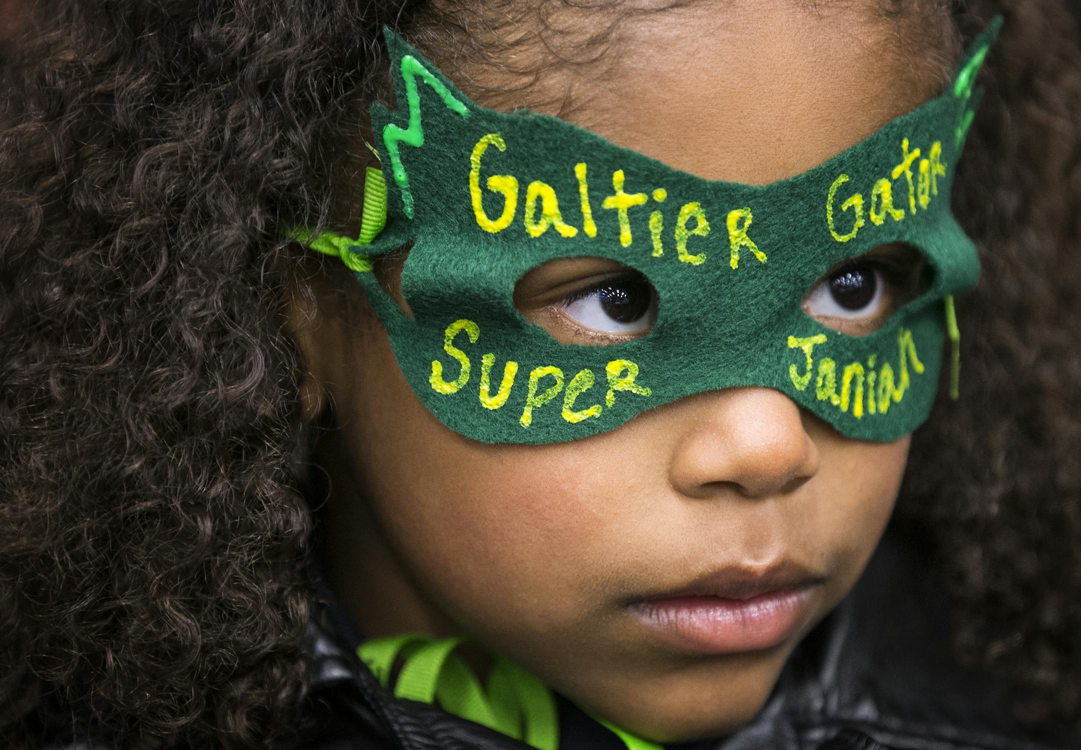 Galtier Community School kindergartener Janiah Jordan, 6, wears a mask supporting her school during the public comment portion of a St. Paul School Board meeting. ] (Leila Navidi/Star Tribune) leila.navidi@startribune.com BACKGROUND INFORMATION: Tuesday, April 26, 2016 at St. Paul School District headquarters. With a plan for $484 million in capital projects awaiting its approval, the St. Paul school board on Tuesday heard from a group of parents and students with a different aim. They are fight