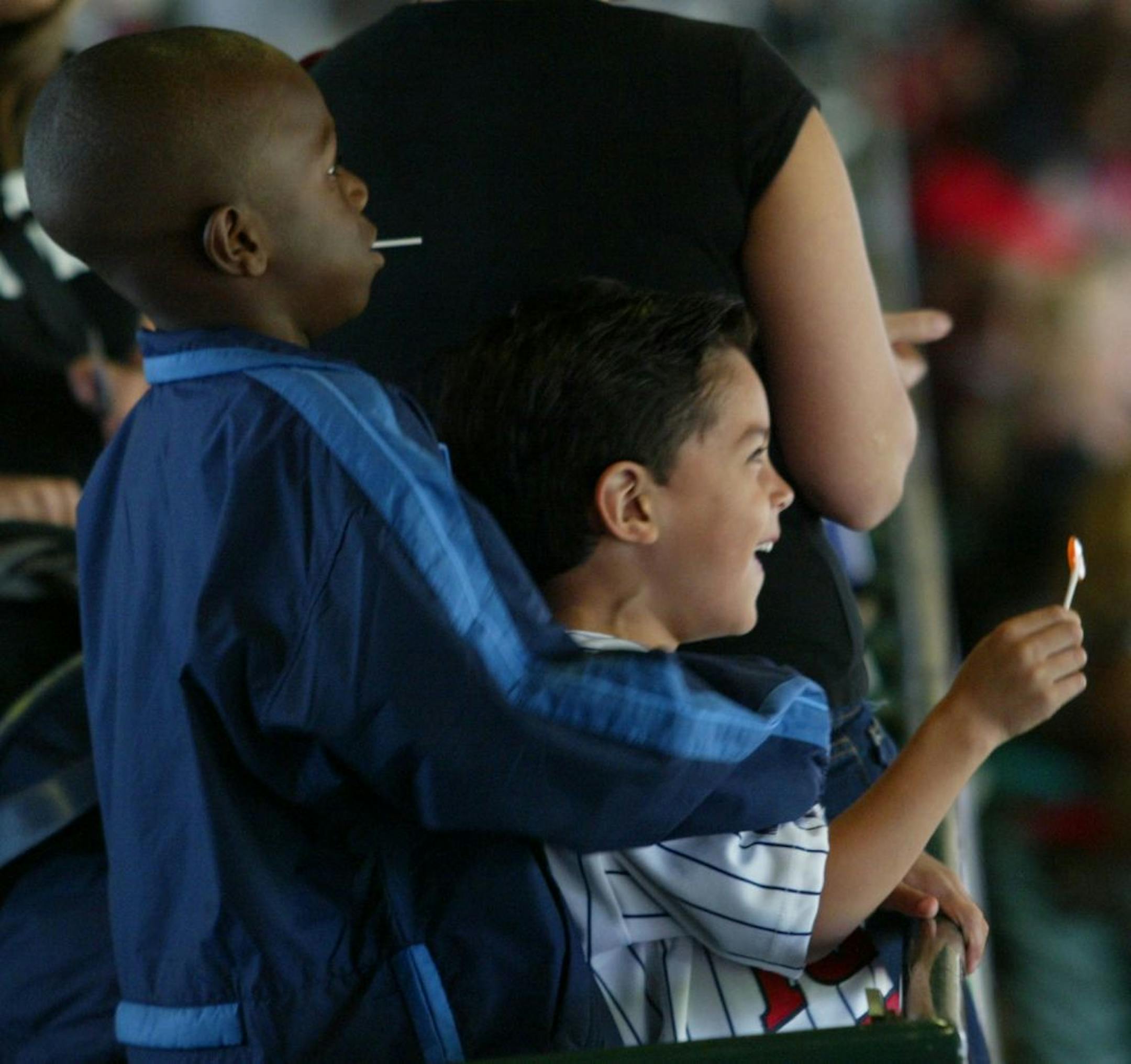 That's Torii Hunter Jr. in 2002, watching his father play for the Twins during the American League Championship Series. He's with Niko Guardado, the son of former Twins' pitcher Eddie Guardado.