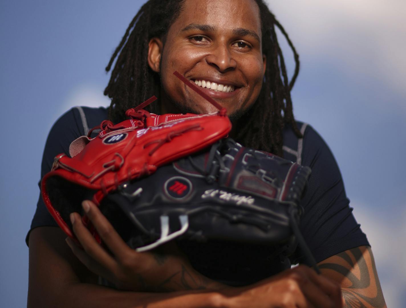 Twins pitcher Ervin Santana with two of his gloves Wednesday afternoon at Hammond Stadium in Fort Myers. ] JEFF WHEELER &#xef; jeff.wheeler@startribune.com The Twins played their first exhibition baseball game against the University of Minnesota team Wednesday night, March 4, 2015, at Hammond Stadium in Fort Myers, FL.