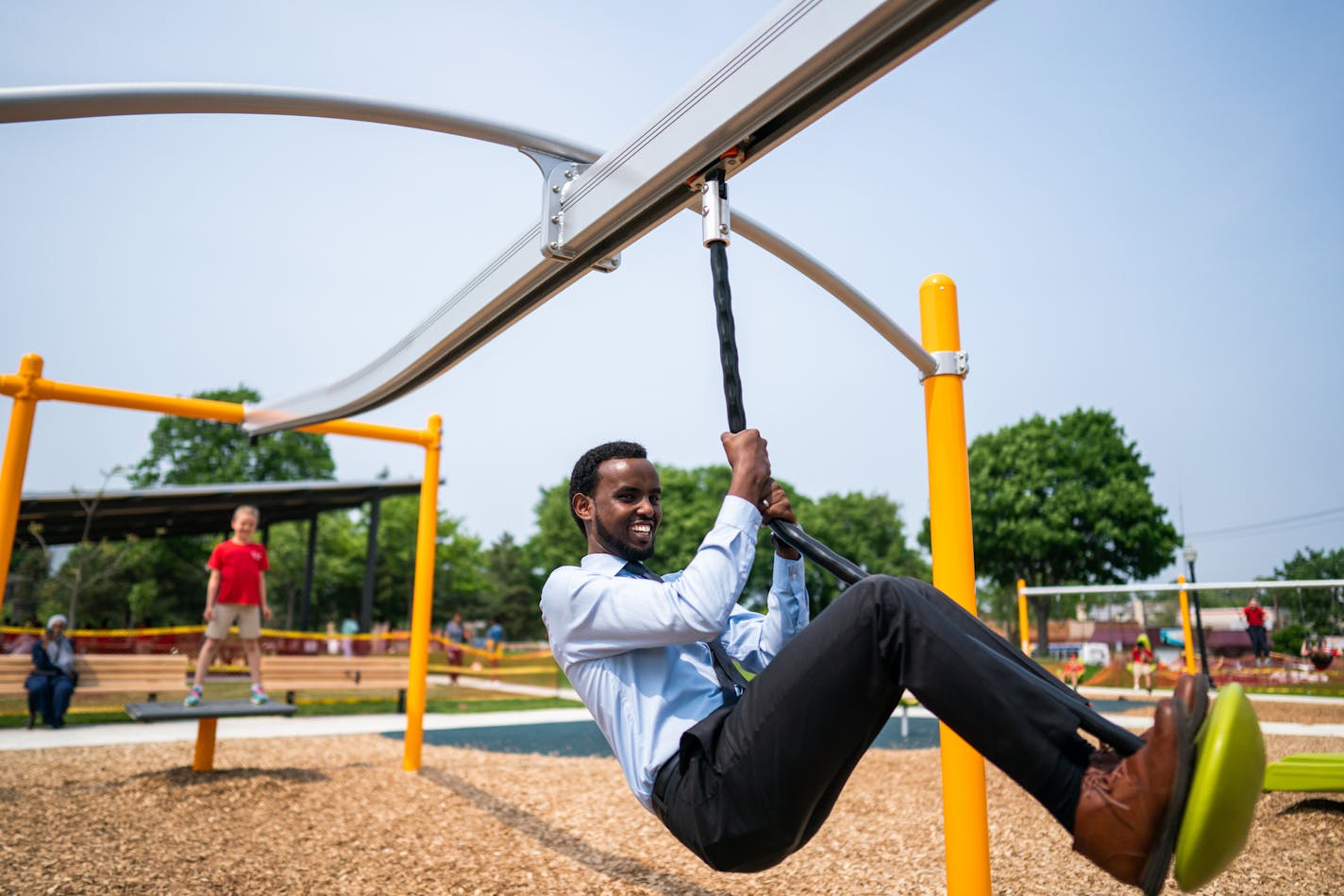 Minneapolis Park and Recreation Board Vice-President and District 3 Commissioner AK Hassan took a swing on the rope slide. ] MARK VANCLEAVE &#xa5; Park and neighborhood leaders celebrated the renovated Peavey Park at Franklin and Chicago avenues in south Minneapolis on Friday, May 31, 2019.