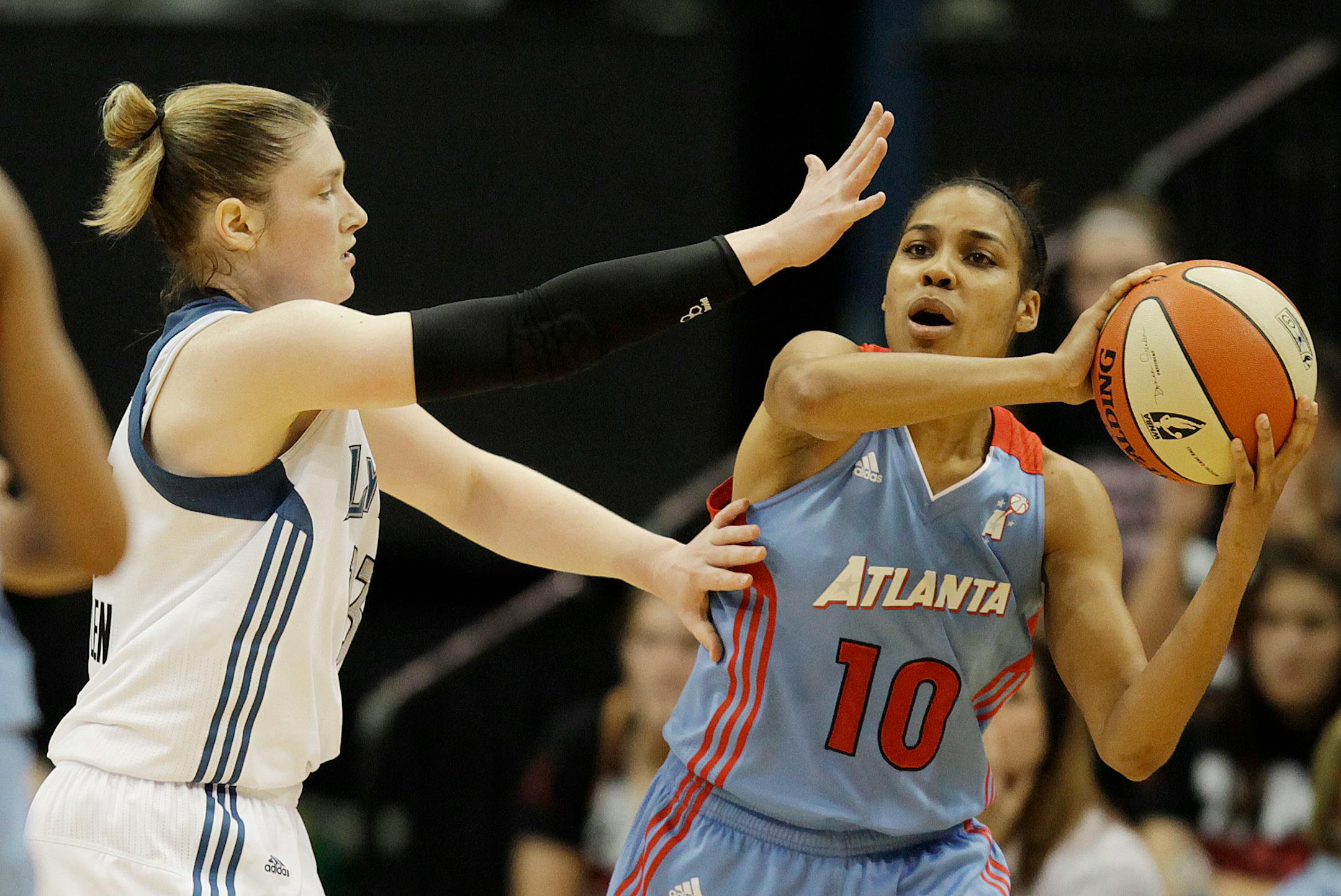 Atlanta guard Lindsey Harding looks to pass around Minnesota's Lindsay Whalen.