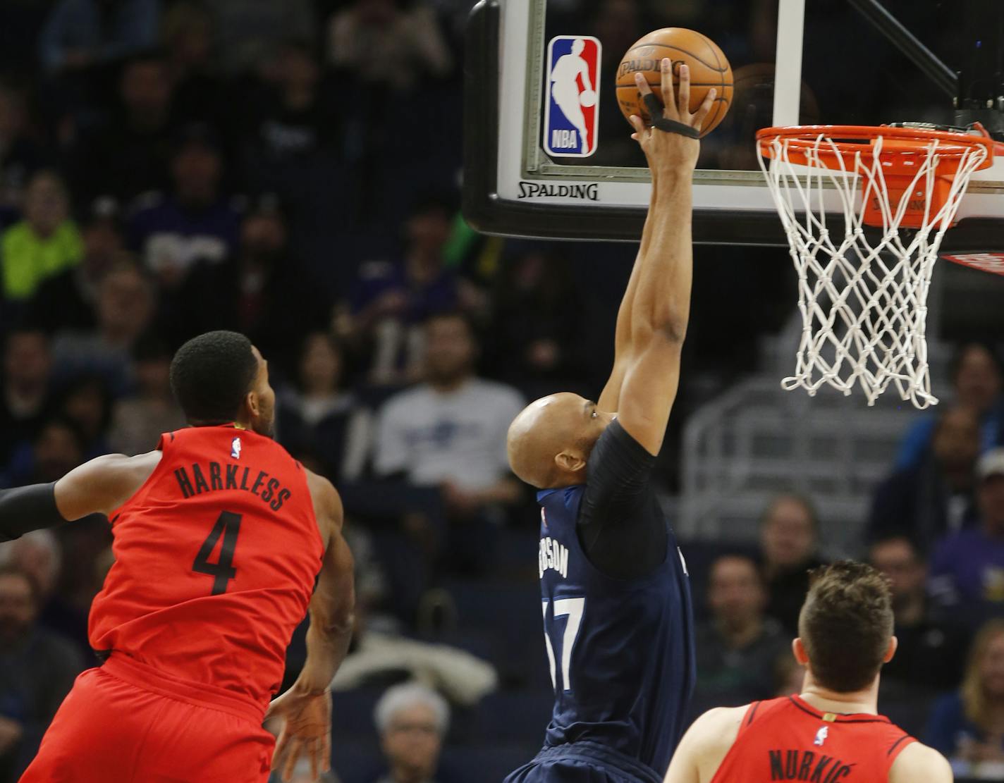 Taj Gibson(67) dunks as he blows by Maurice Harkless(4).]The Wolves take on the Blazers at Target Center. Richard Tsong-Taatarii&#xef;rtsong-taatarii@startribune.com