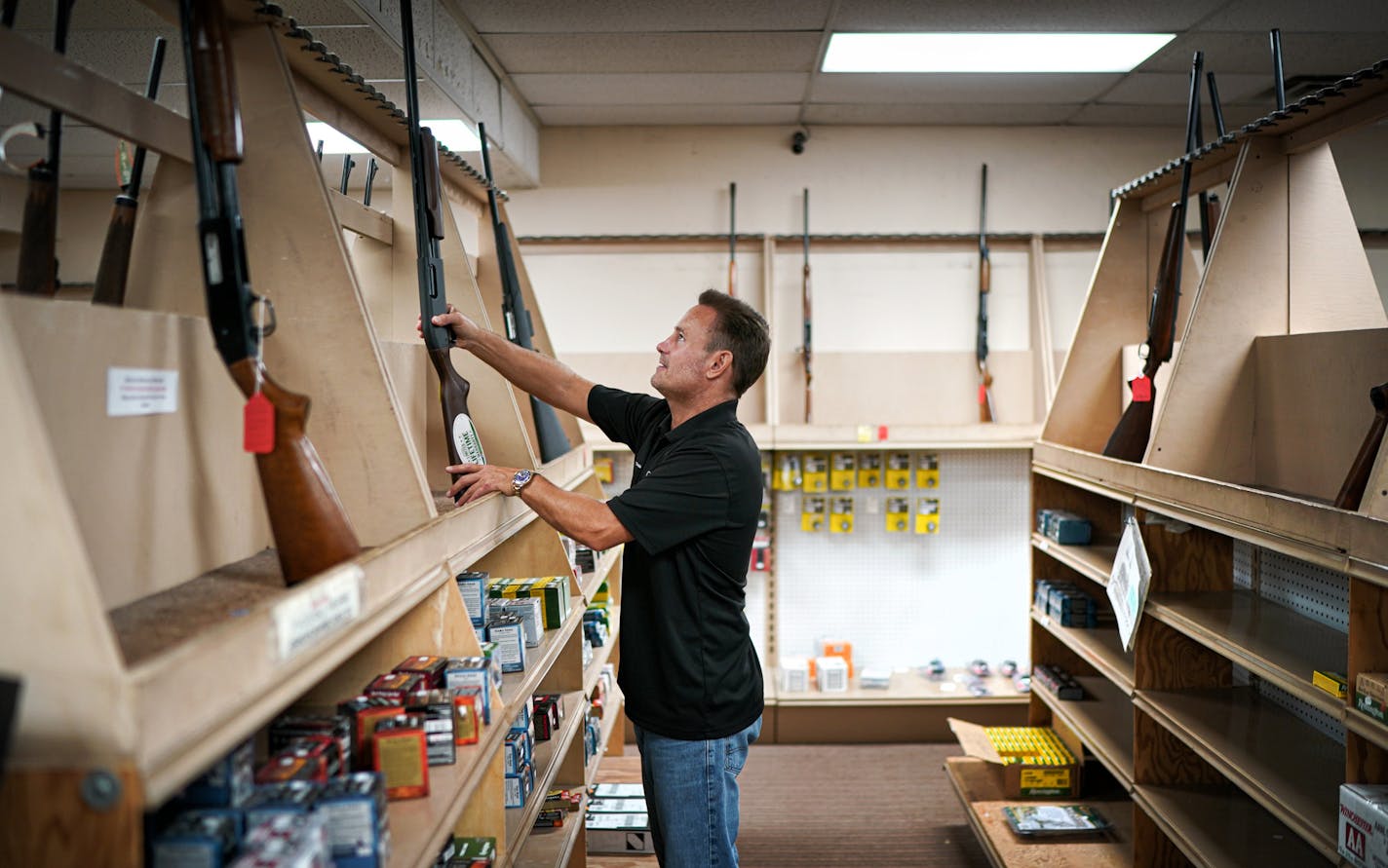 The shelves are nearly empty of shotguns at Frontiersman Sports in St. Louis Park. Owner Kory Krause said those who visit the store are buying shotguns and handguns more than military-style rifles.