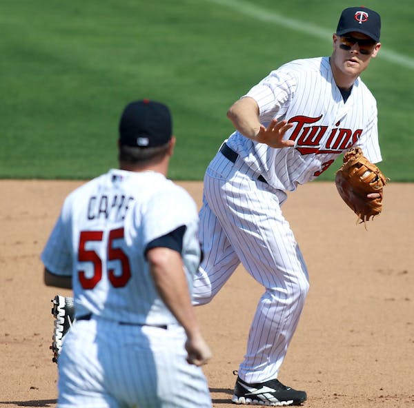 Justin Morneau, who missed much of the last two seasons because of injuries, made a play at first base in Saturday's spring opener against the Rays.