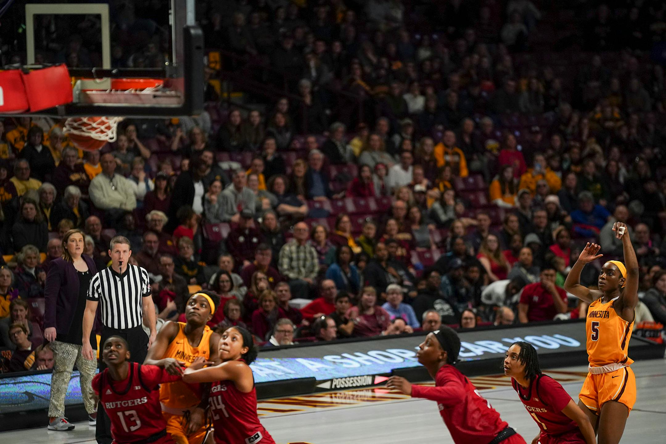 Gophers forward Taiye Bello (5) sank the third of her three free throws after being fouled by Rutgers Scarlet Knights center Maori Davenport (15) in the second overtime.