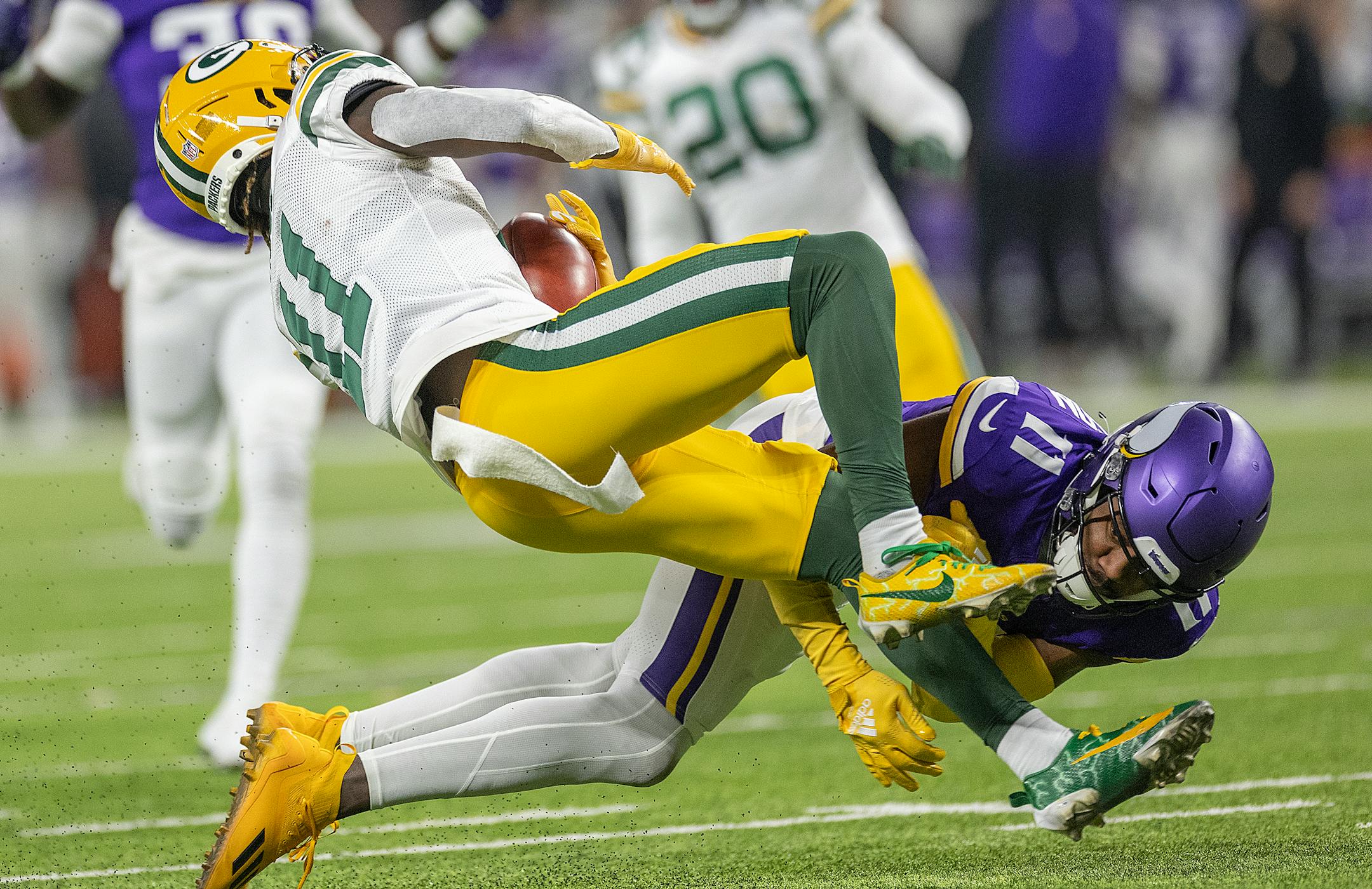 Vikings cornerback NaJee Thompson (11) took down Packers wide receiver Jayden Reed (11) during a punt return in the second quarter at U.S. Bank Stadium, in Minneapolis, Minn., on Sunday, Dec. 31, 2023. ] Elizabeth Flores • liz.flores@startribune.com