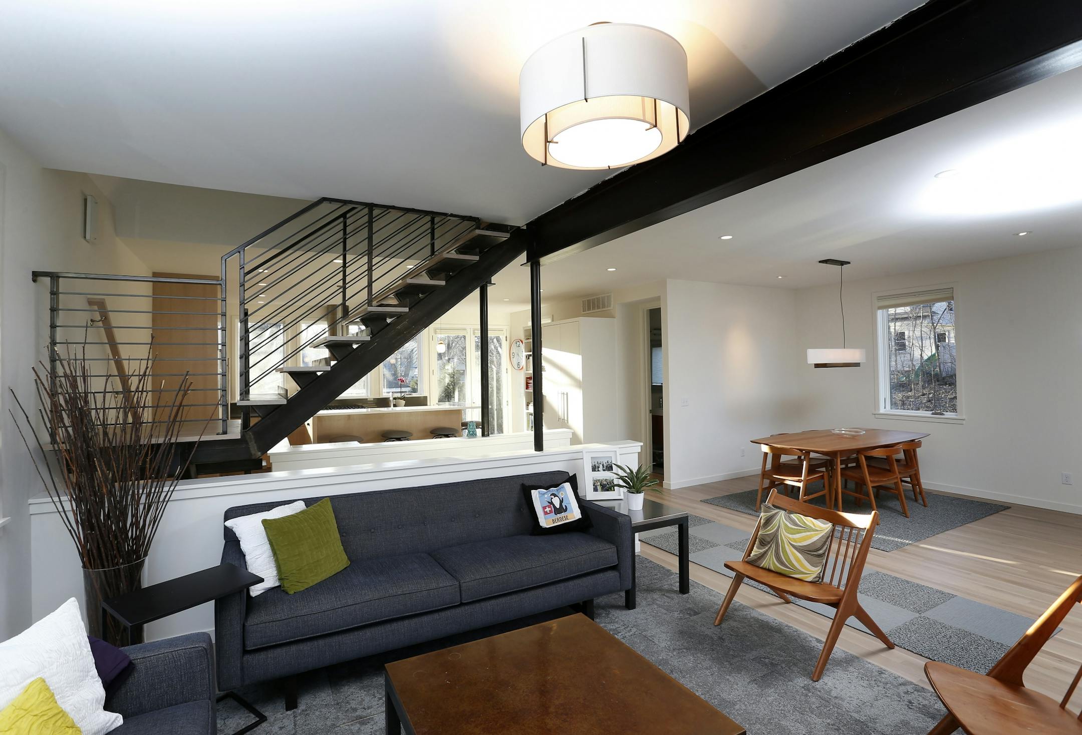 The new main floor has an open floor plan and free-standing staircase.