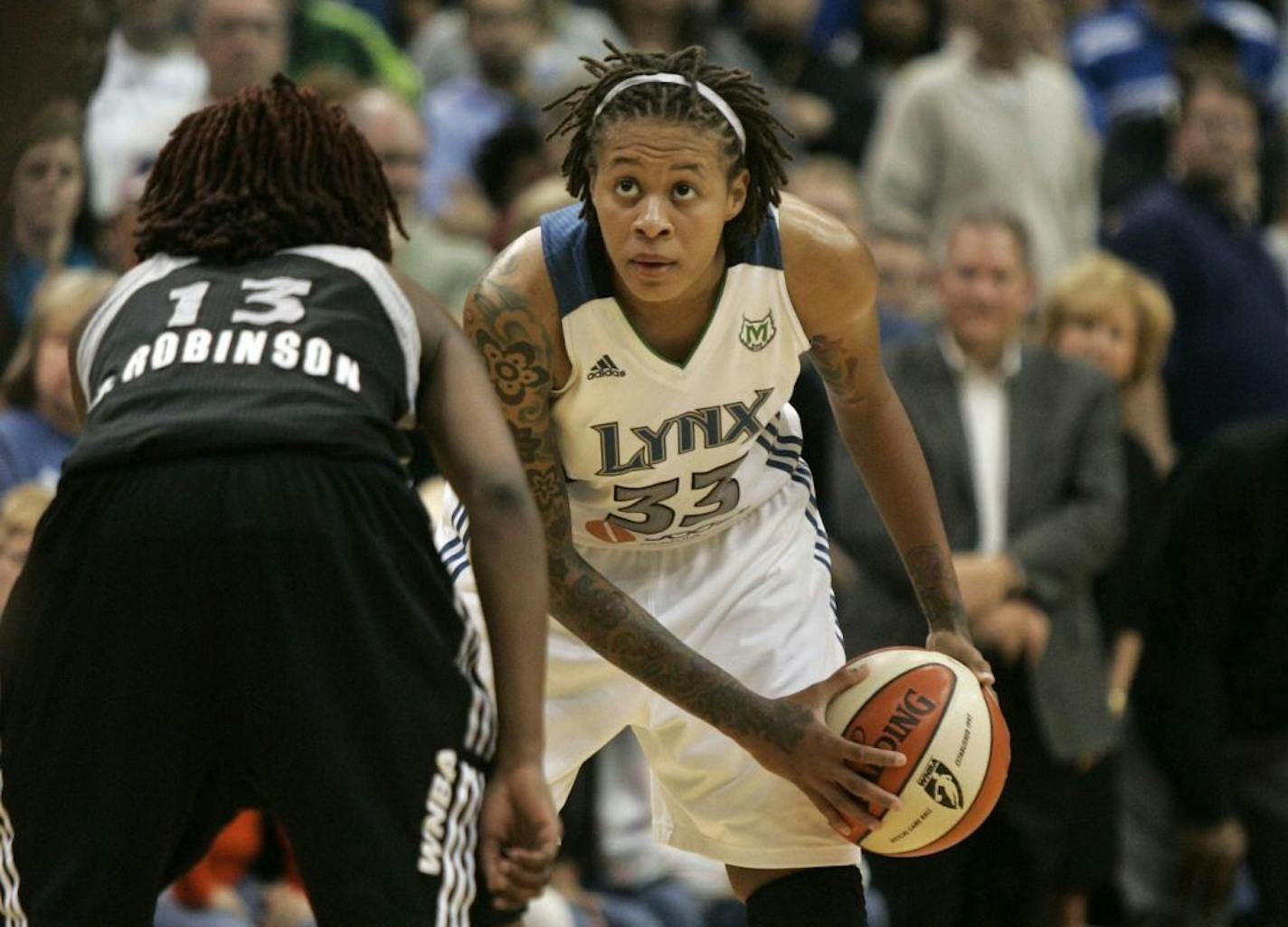 Lynx Seimone Augustus watched the shot count down before taking her shot near the end of the fourth quarter at the Target Center in Minneapolis Minn., Friday, September 16, 2011. Lynx won 66-65.