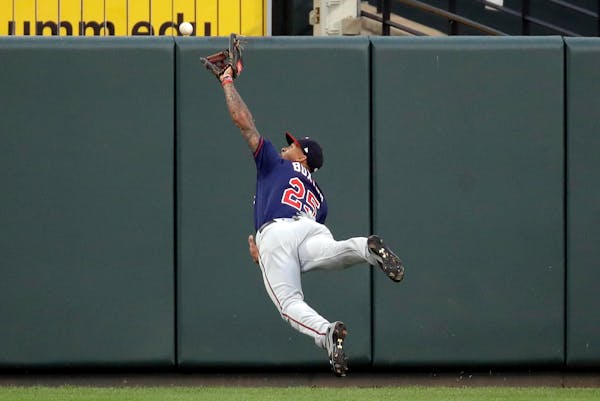 Twins center fielder Byron Buxton reached but couldn't quite catch this fly ball double hit by the Orioles' Trey Mancini in the second inning Monday.