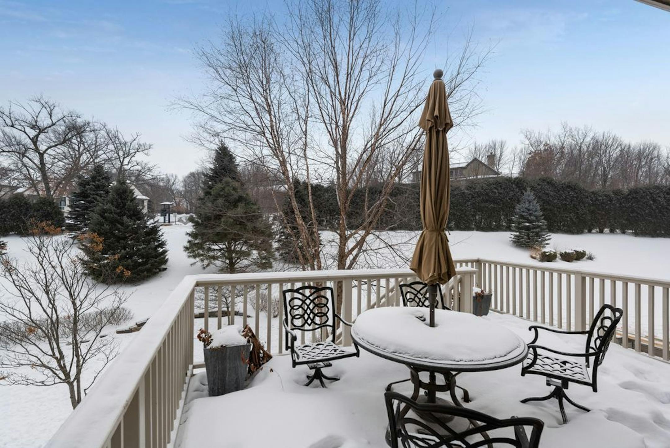 There's a deck overlooking the backyard.