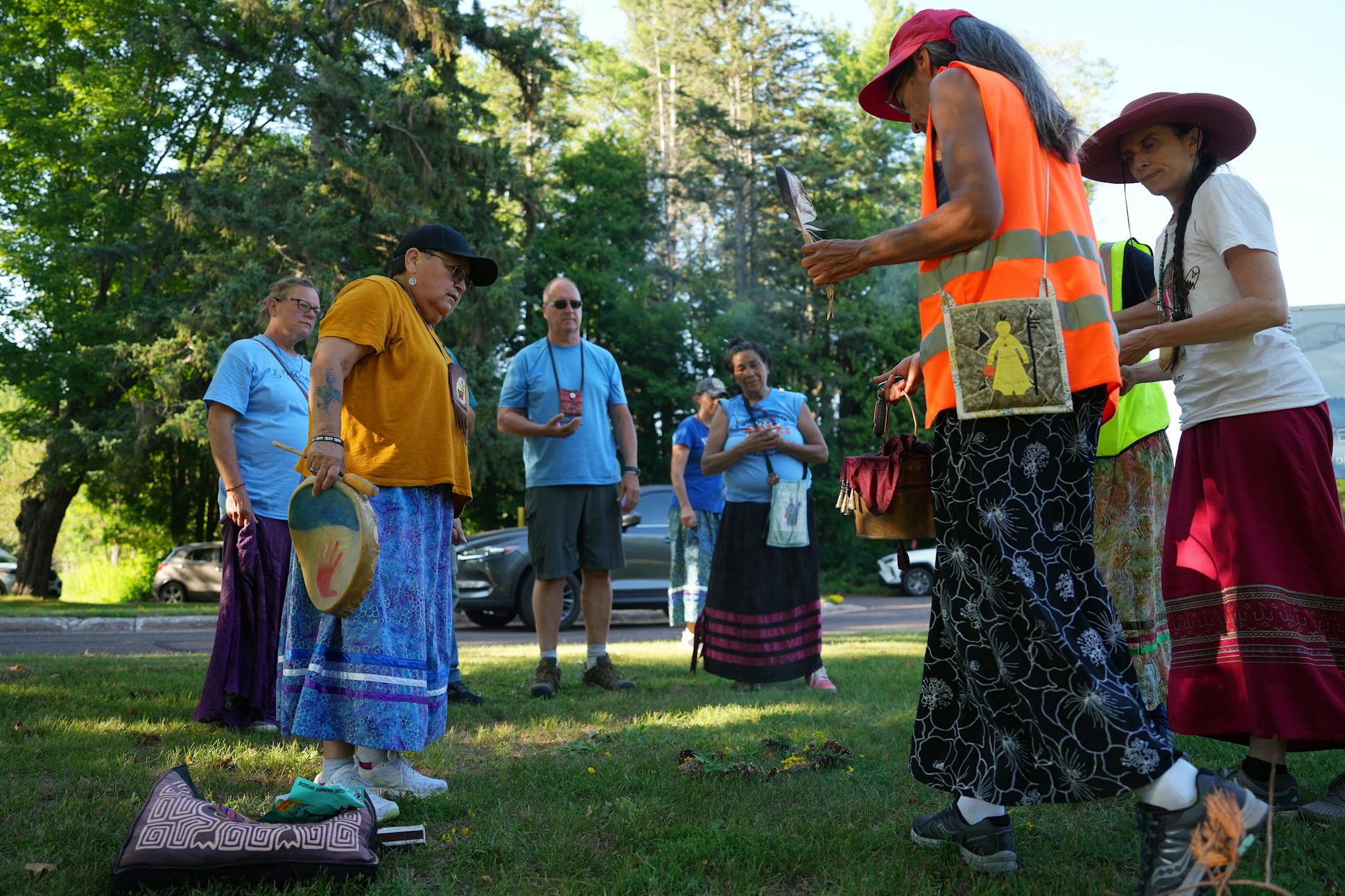 Sharon Day leads an evening ceremony with singing and drumming during the Lake Superior Nibi Water Walk.