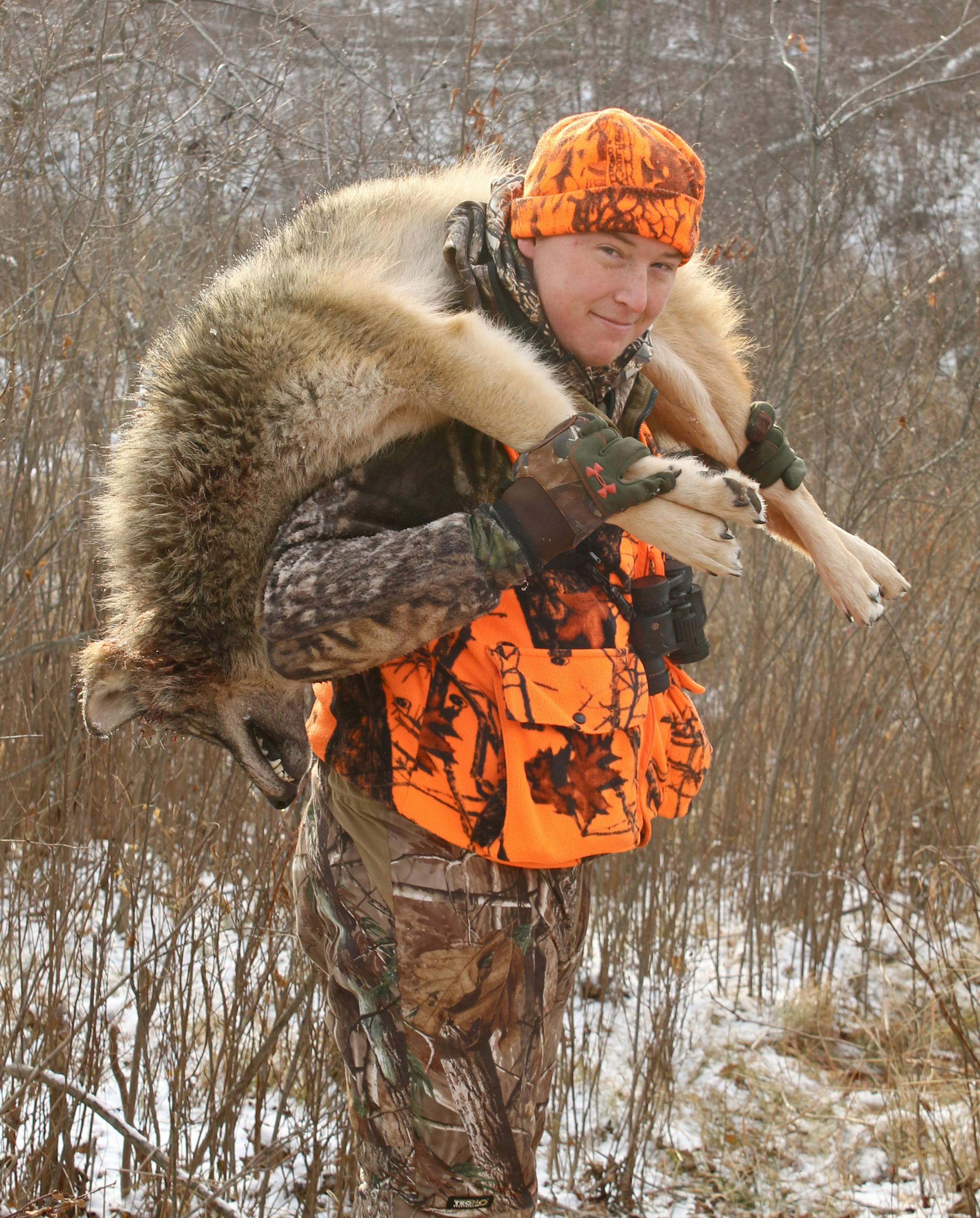 Andrew Seagren, 21, of Bemidji with a wolf he killed on the last day of Minnesota's early wolf season. As of Tuesday, hunters and trappers had killed 107 wolves this fall; the target goal set by the DNR is 220 wolves.
