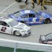 Brad Keselowski's (2) car was damaged in a pit road accident with Kasey Kahan (5) and Kurt Busch (41) during a NASCAR Sprint Cup Series auto race at M