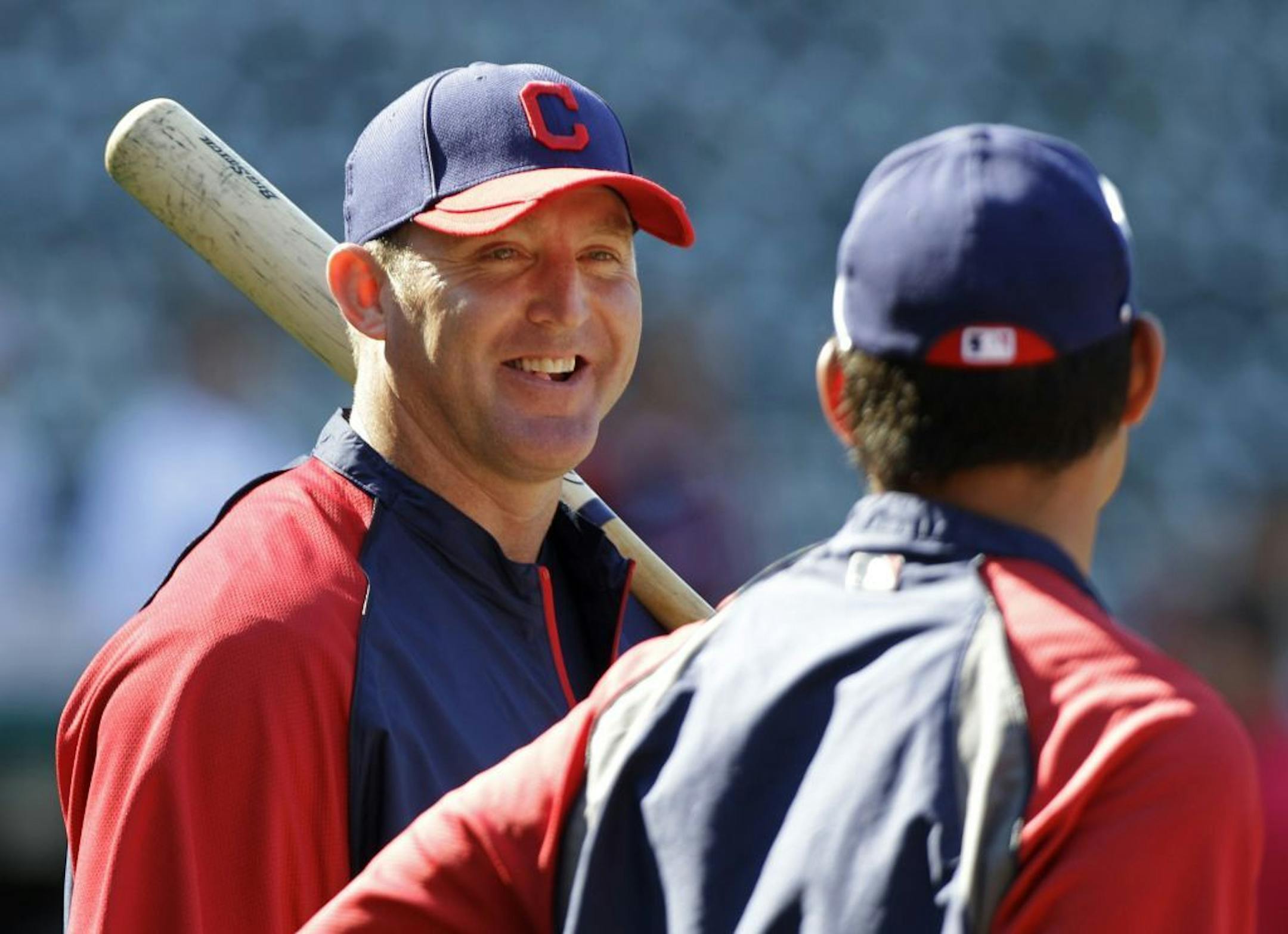 Cleveland Indians' Jim Thome, left, talks with Kosuke Fukudome during batting practice before a baseball game against the Kansas City Royals Friday, Aug. 26, 2011, in Cleveland.