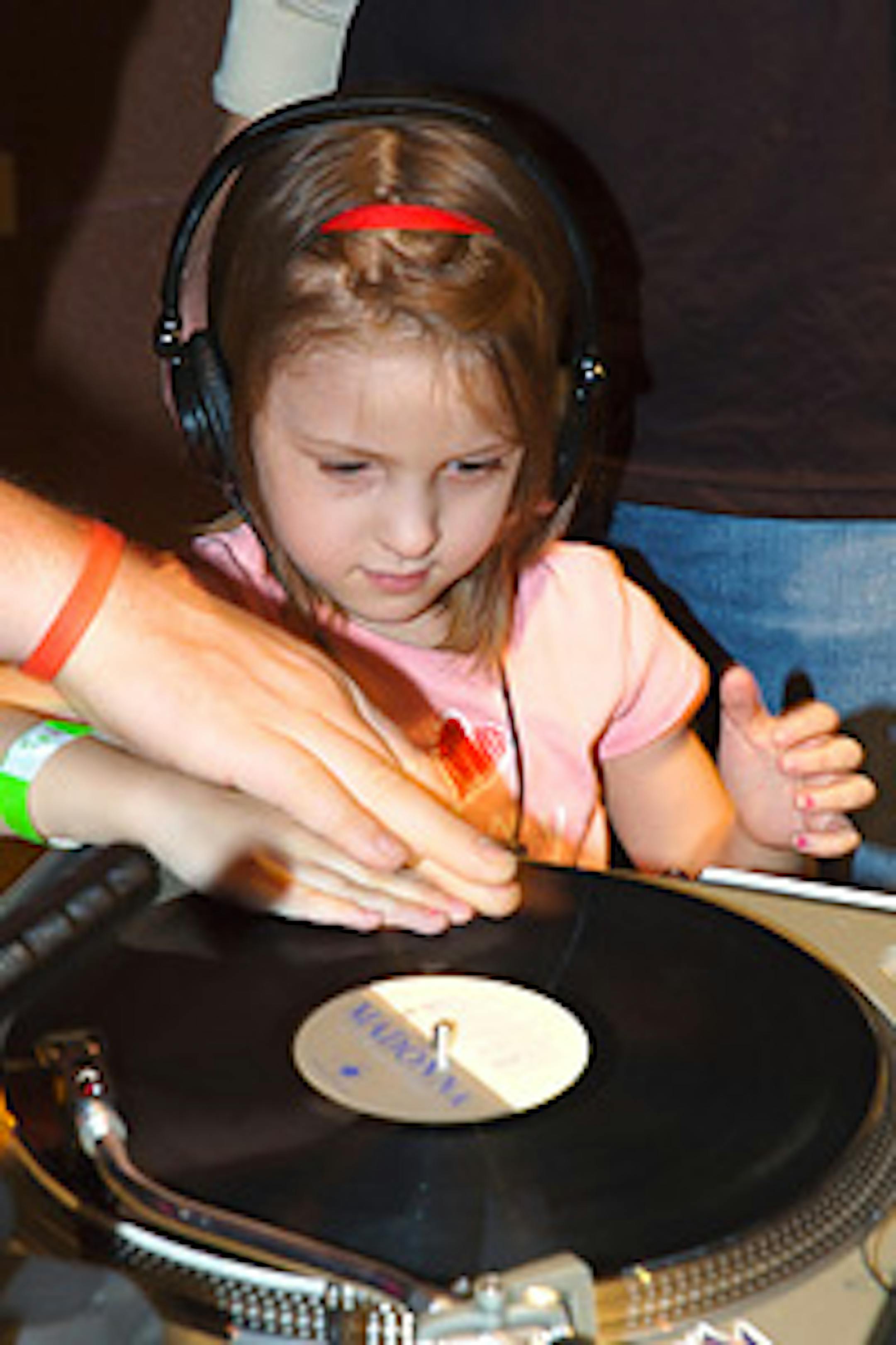 Kids learn to scratch records