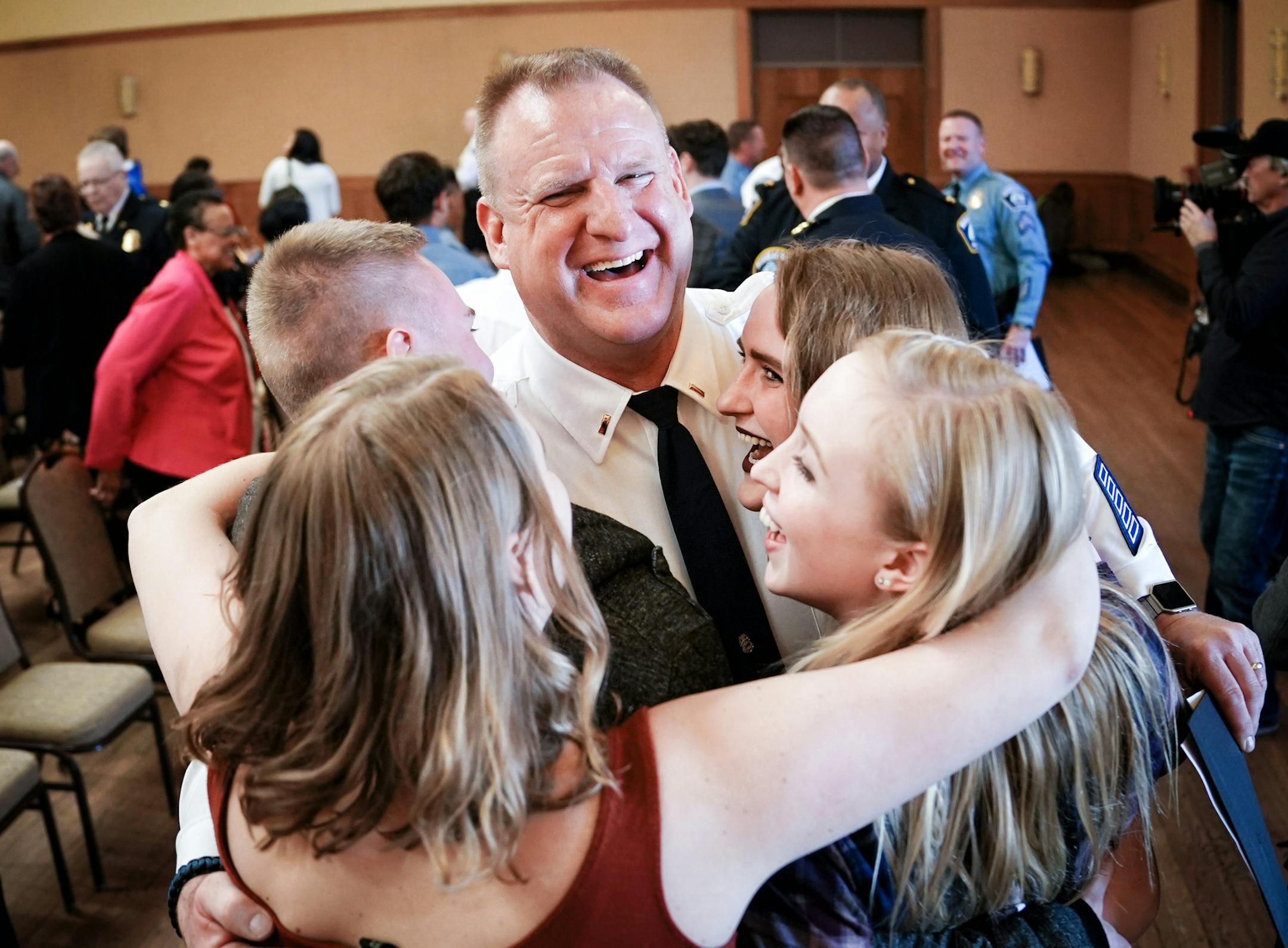 New Lieutenant Eric Dison got a group hug from his two daughters, along with a niece and nephew after the ceremony. ] GLEN STUBBE • glen.stubbe@startribune.com Tuesday, April 17, 2018 The 2018 Minneapolis Police Promotional Ceremony where Chief Medaria Arradondo presided over the swearing in of one new inspector, eight lieutenants and sixteen new sergeants. EDS, he asked that we don't use names.