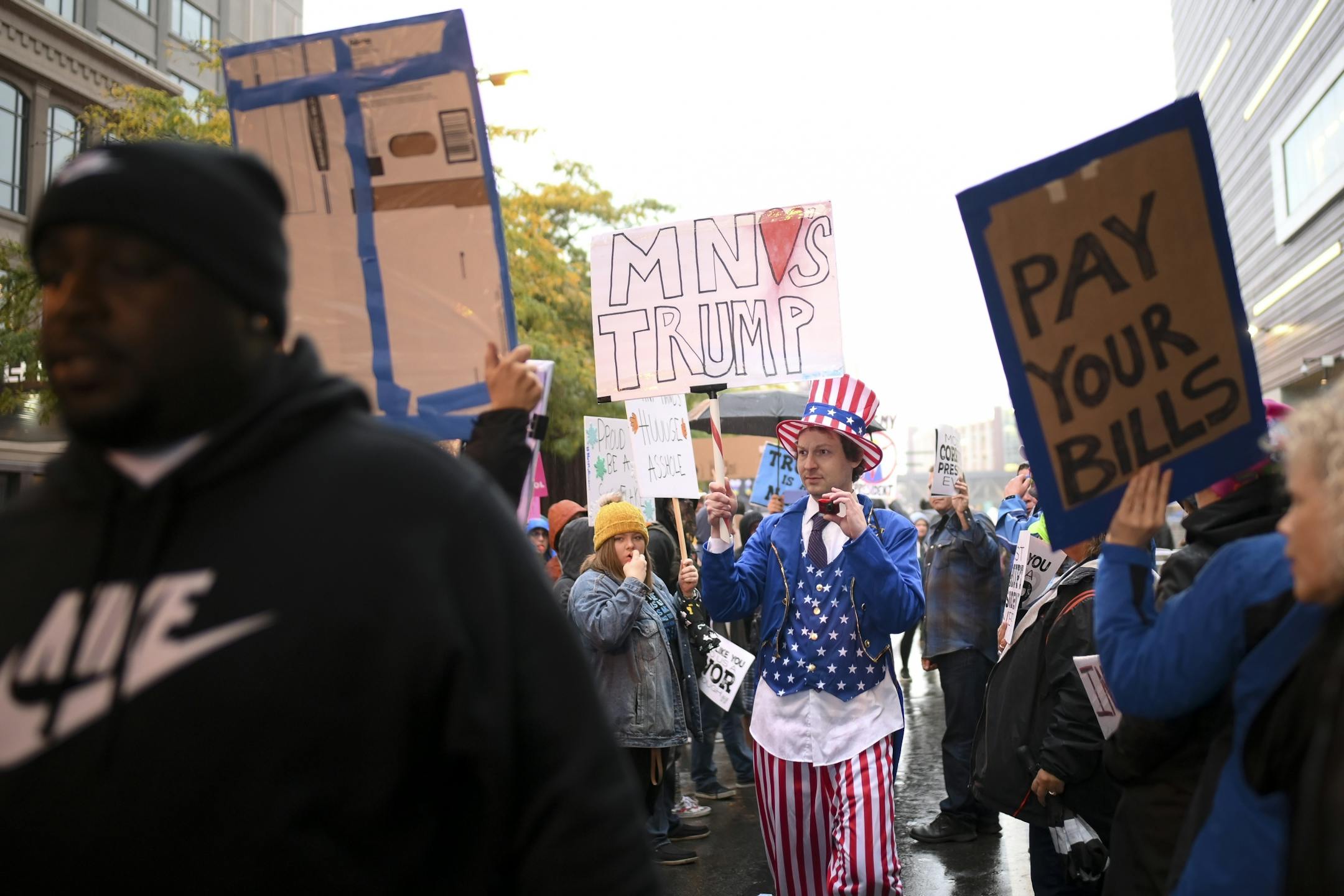 A Trump supporter made his way toward Target Center as he walked through a crowd of protesters Thursday night.