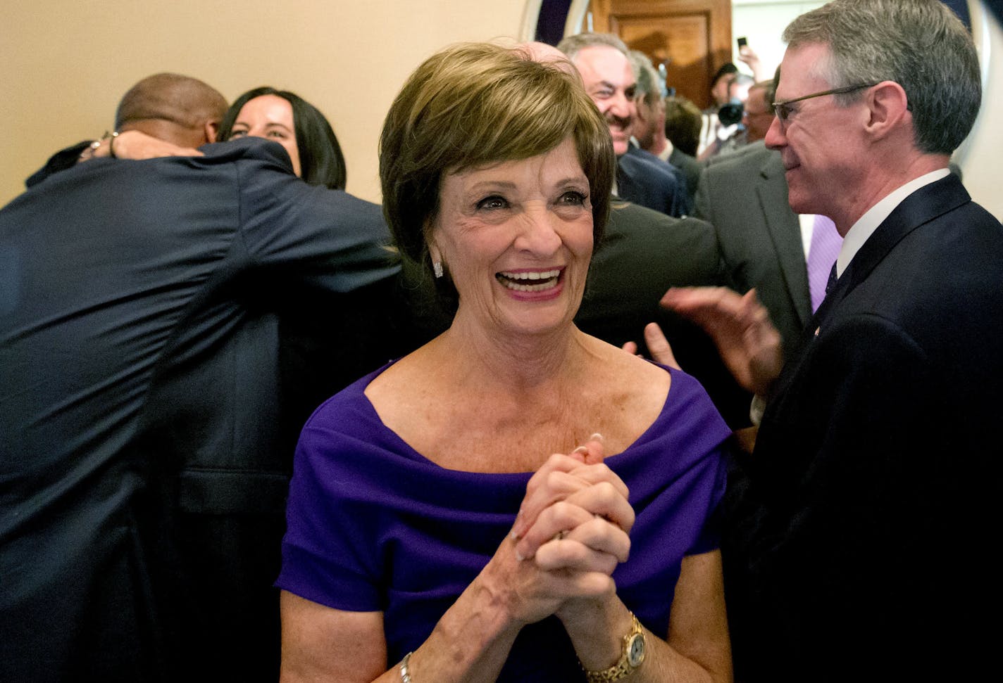 Minneapolis bid committee co-chair Marilyn Carlson Nelson smiles after Minneapolis was selected as the host for 2018 Super Bowl, at the NFL's spring meetings, Tuesday, May 20, 2014, in Atlanta. Minneapolis will host the 2018 Super Bowl after a vote by owners on Tuesday rewarded the city for getting a new stadium deal. The owners chose Minneapolis and the new $1 billion stadium planned for the site of the old Metrodome to host the championship over New Orleans and Indianapolis. (AP Photo/David Go