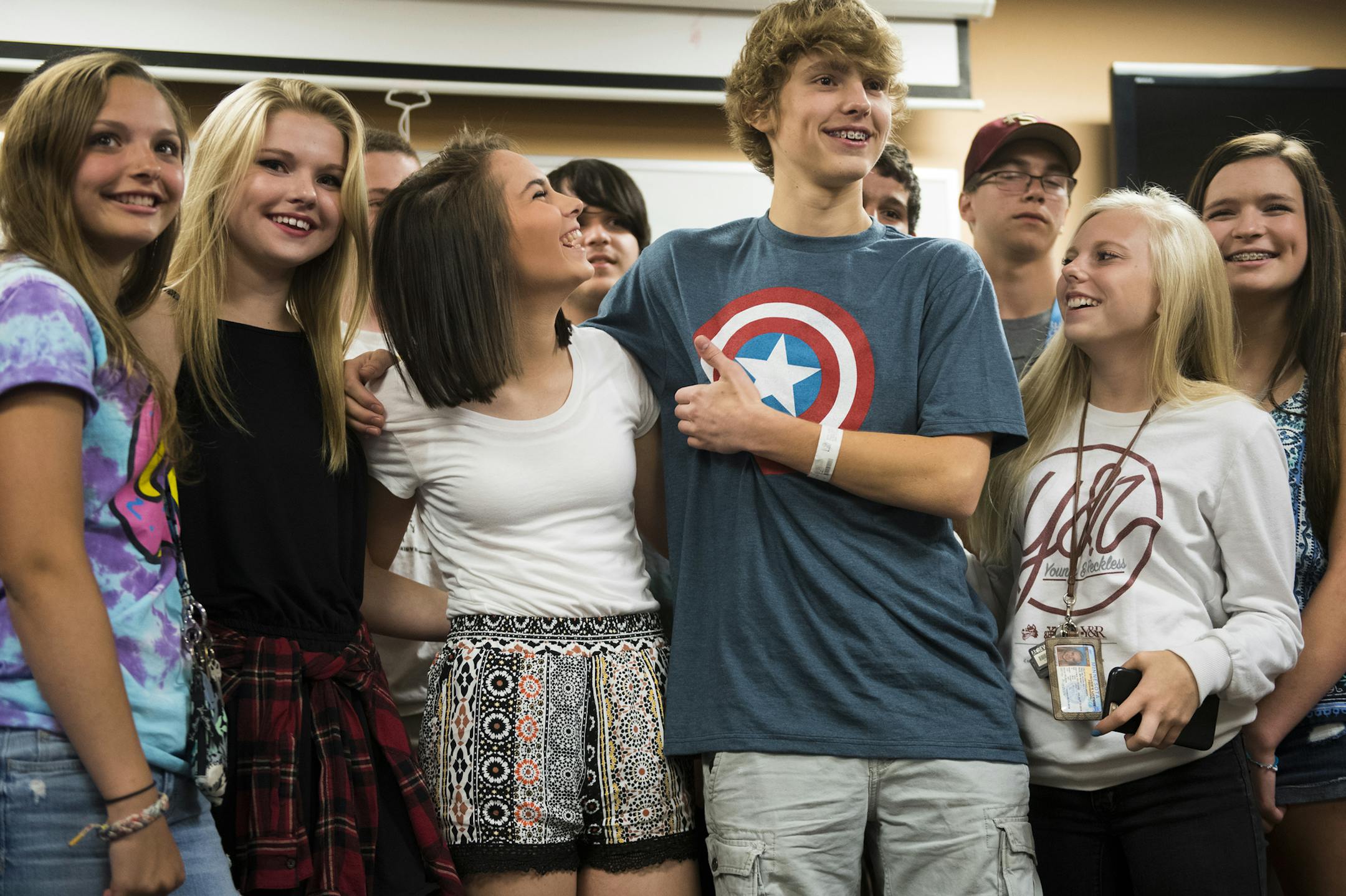 Daniel Fleigle and a group of his friends posed for cameras after a press conference held at the hospital on Monday. ] Isaac Hale • isaac.hale@startribune.com Daniel Fleigle and his family held a press conference Monday, June 27, 2016, at the HCMC Emergency Department in downtown Minneapolis, MN. Fleigle was climbing atop a long-closed Mississippi River Bridge earlier in June when he was shocked by an electrical wire and fell about 30 feet.