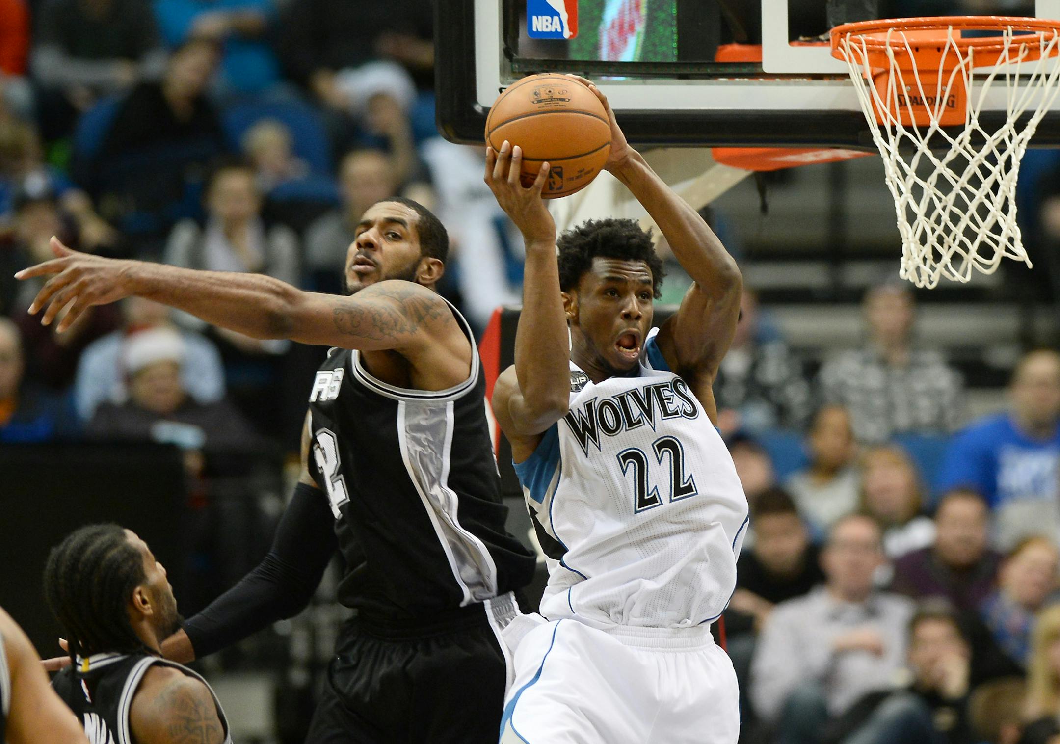 Minnesota Timberwolves guard Andrew Wiggins (22) was unable to dunk off an alley oop as the result of defense by San Antonio Spurs forward LaMarcus Aldridge (12) in the second quarter. ] (AARON LAVINSKY/STAR TRIBUNE) aaron.lavinsky@startribune.com The Minnesota Timberwolves played the San Antonio Spurs on Wednesday, Dec. 23, 2015 at Target Center in Minneapolis, Minn.