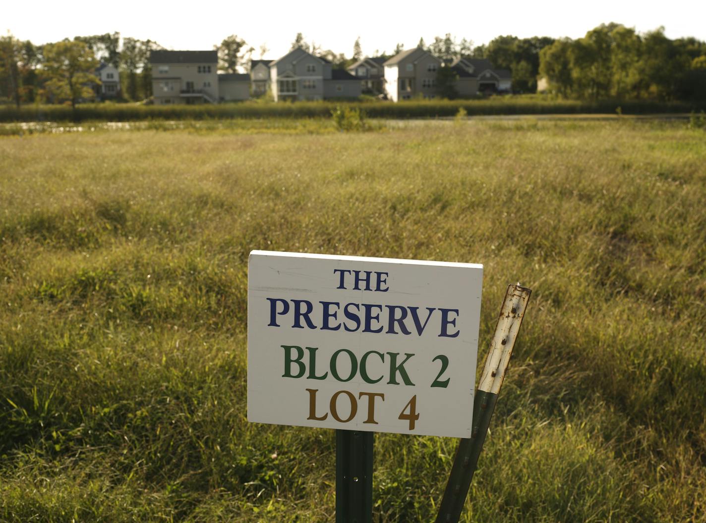 An empty lot available next door to the Janssen's in the Preserve at Lino Lakes Monday evening in Lino Lakes. ] JEFF WHEELER &#xef; jeff.wheeler@startribune.com There are 1,235 new homes on the drawing board for Lino Lakes. That could add nearly 4,000 new people to the city of 20,000 on Anoka County's southern border. George and Shannon Janssen are among an eager wave of newcomers moving into homes on woodsy lots in the new developments. They were photographed Monday evening, September 7, 2015.