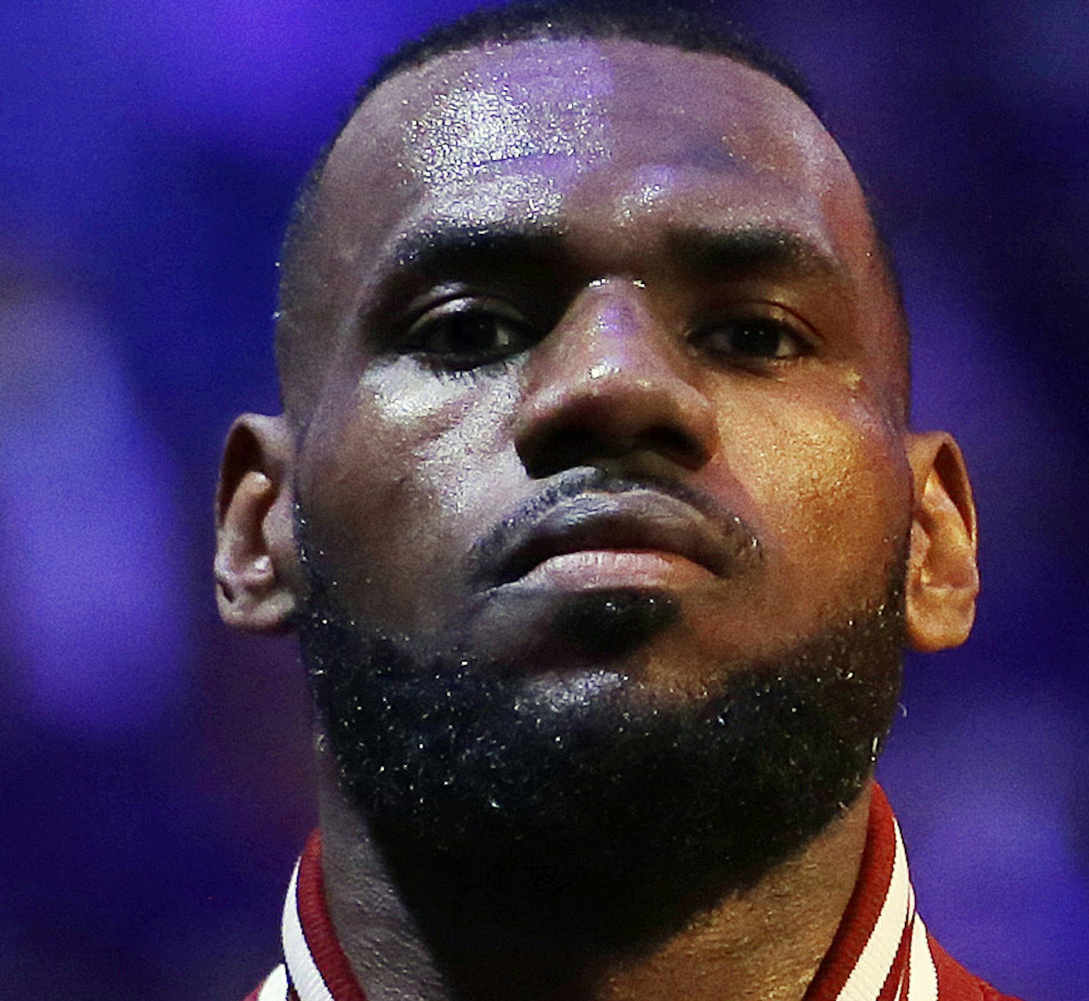 Cleveland Cavaliers forward LeBron James (23) waits during the playing of the national anthem before the start of Game 6 of basketball's NBA Finals against the Golden State Warriors, in Cleveland, Tuesday, June 16, 2015. (AP Photo/Tony Dejak)