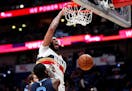 New Orleans Pelicans forward Anthony Davis (23) slam-dunks over Memphis Grizzlies forward JaMychal Green (0) in the second half of an NBA basketball g