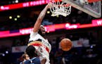 New Orleans Pelicans forward Anthony Davis (23) slam-dunks over Memphis Grizzlies forward JaMychal Green (0) in the second half of an NBA basketball g