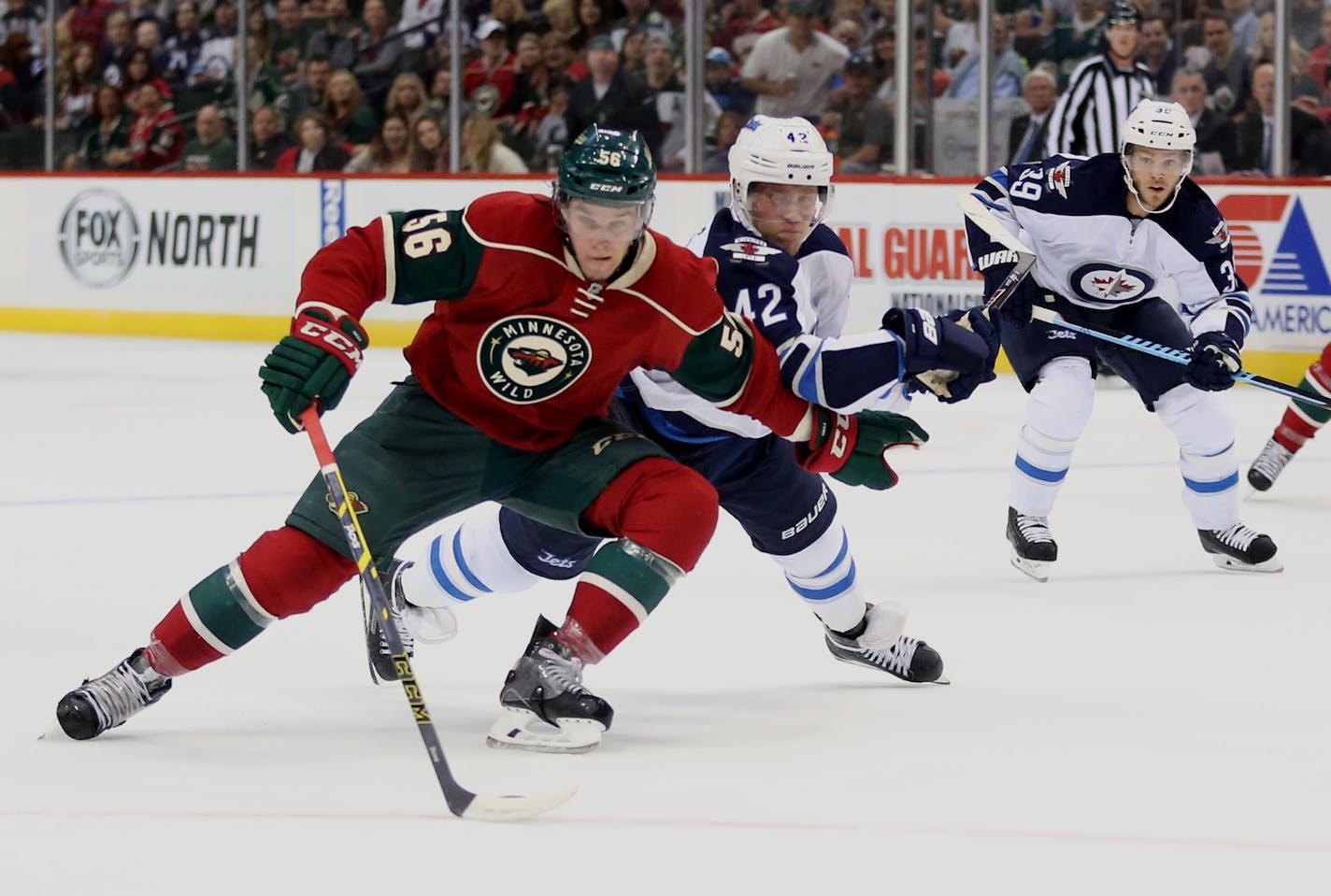 Wild center Erik Haula, left.