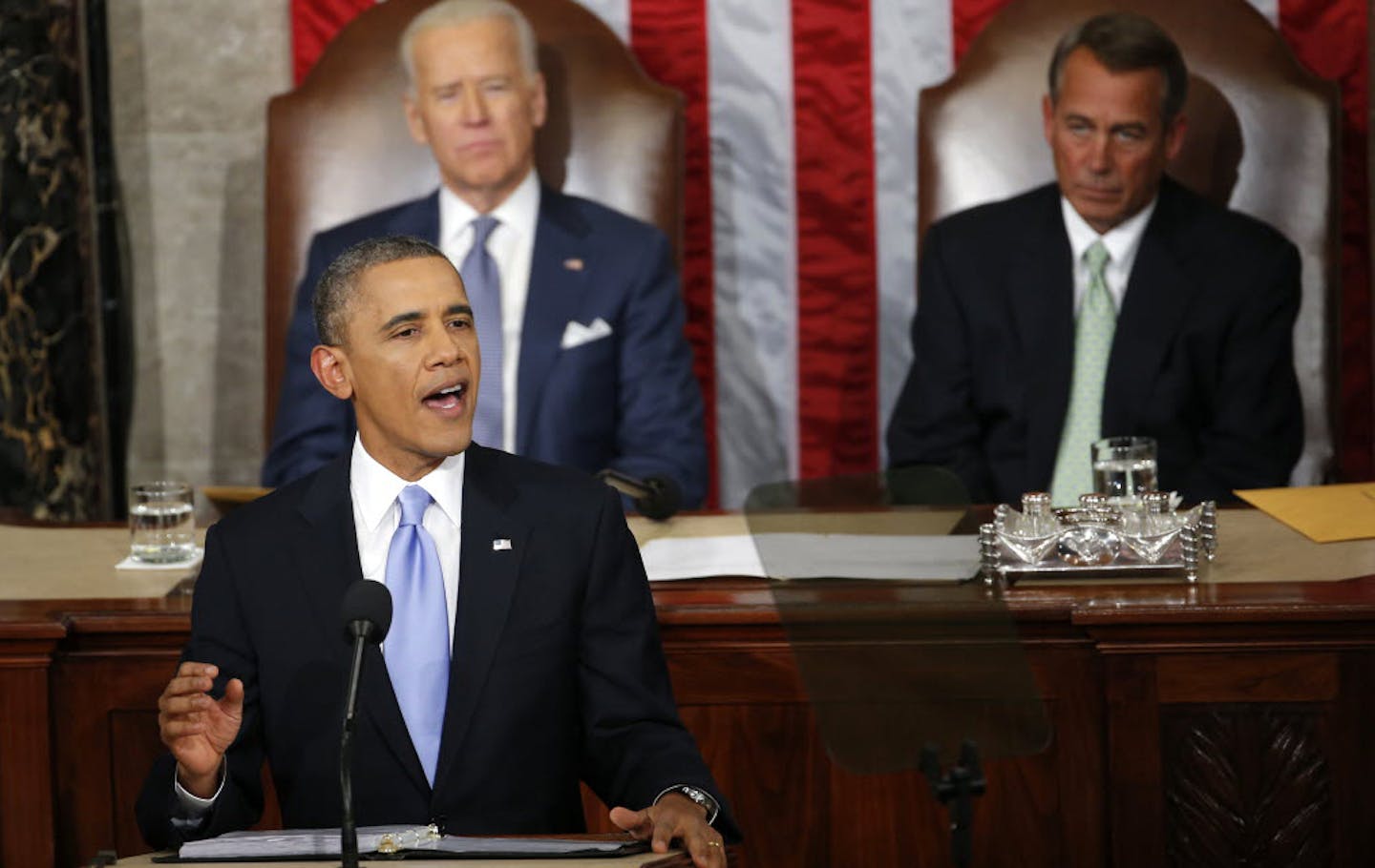 President Barack Obama gives his State of the Union address on Capitol Hill , Tuesday Jan. 28, 2014, as Vice President Joe Biden and House Speaker John Boehner of Ohio, listen.