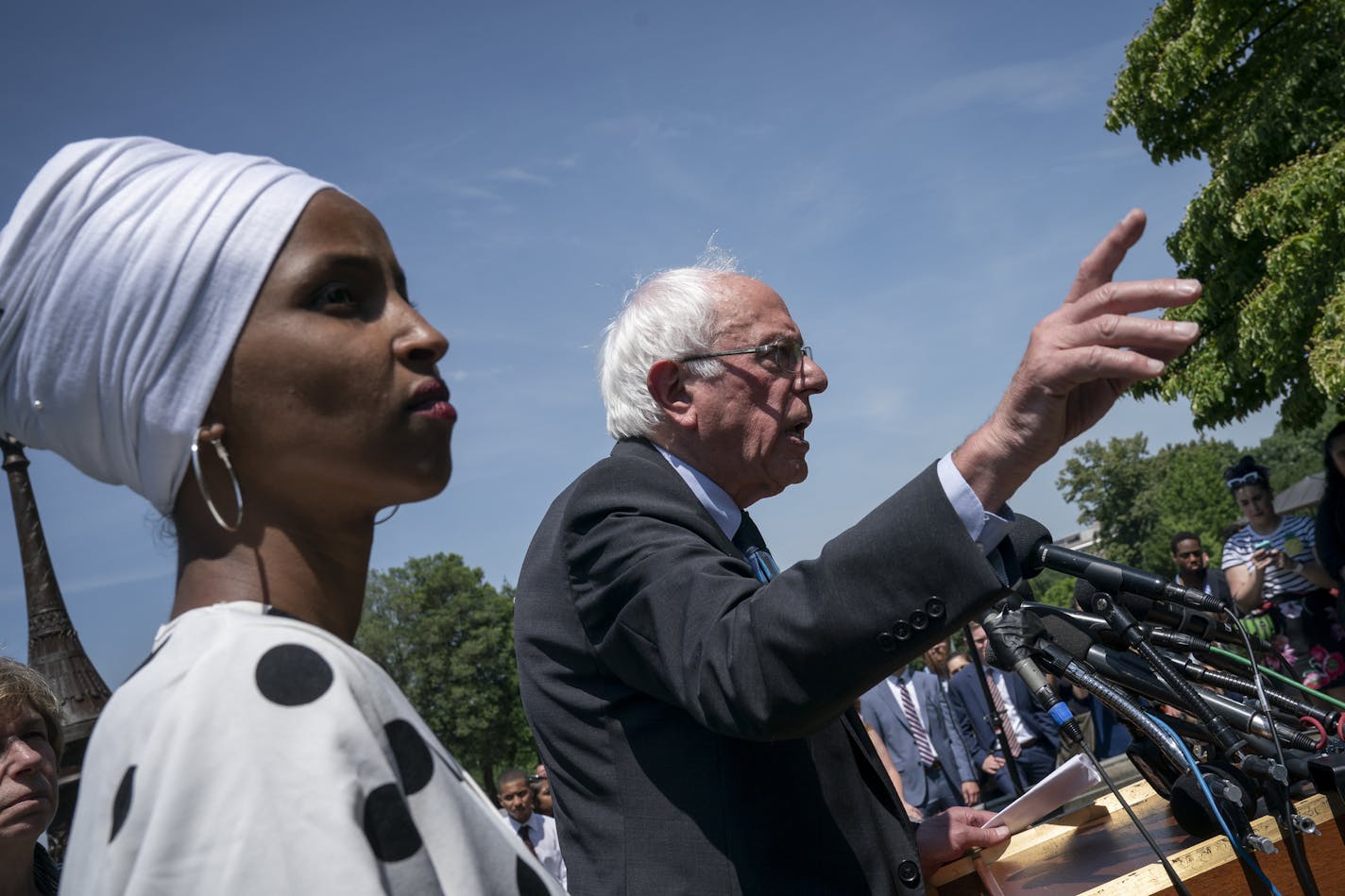 Democratic presidential candidate, Sen. Bernie Sanders, I-Vt., center, joined at left by Rep. Ilhan Omar, D-Minn., announces legislation to cancel all student debt, at the Capitol in Washington, Monday, June 24, 2019. Sanders called the student debt burden in this country the absurdity of sentencing an entire generation, the millennial generation, to a lifetime of debt for the crime of doing the right thing. (AP Photo/J. Scott Applewhite)