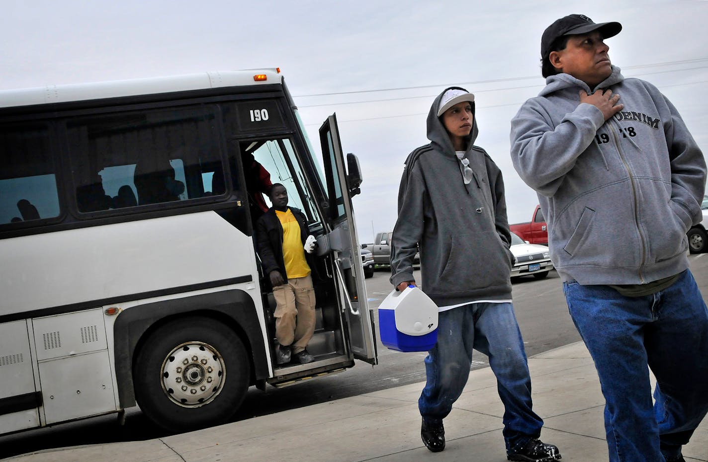 Workers bussed in from Sioux Falls, S.D. head into the Pipestone, Minn. Suzlon plant at 6:38 am. suzlon busses workers from Sioux Falls and Worthington every day because of the shortage of workers in the area.