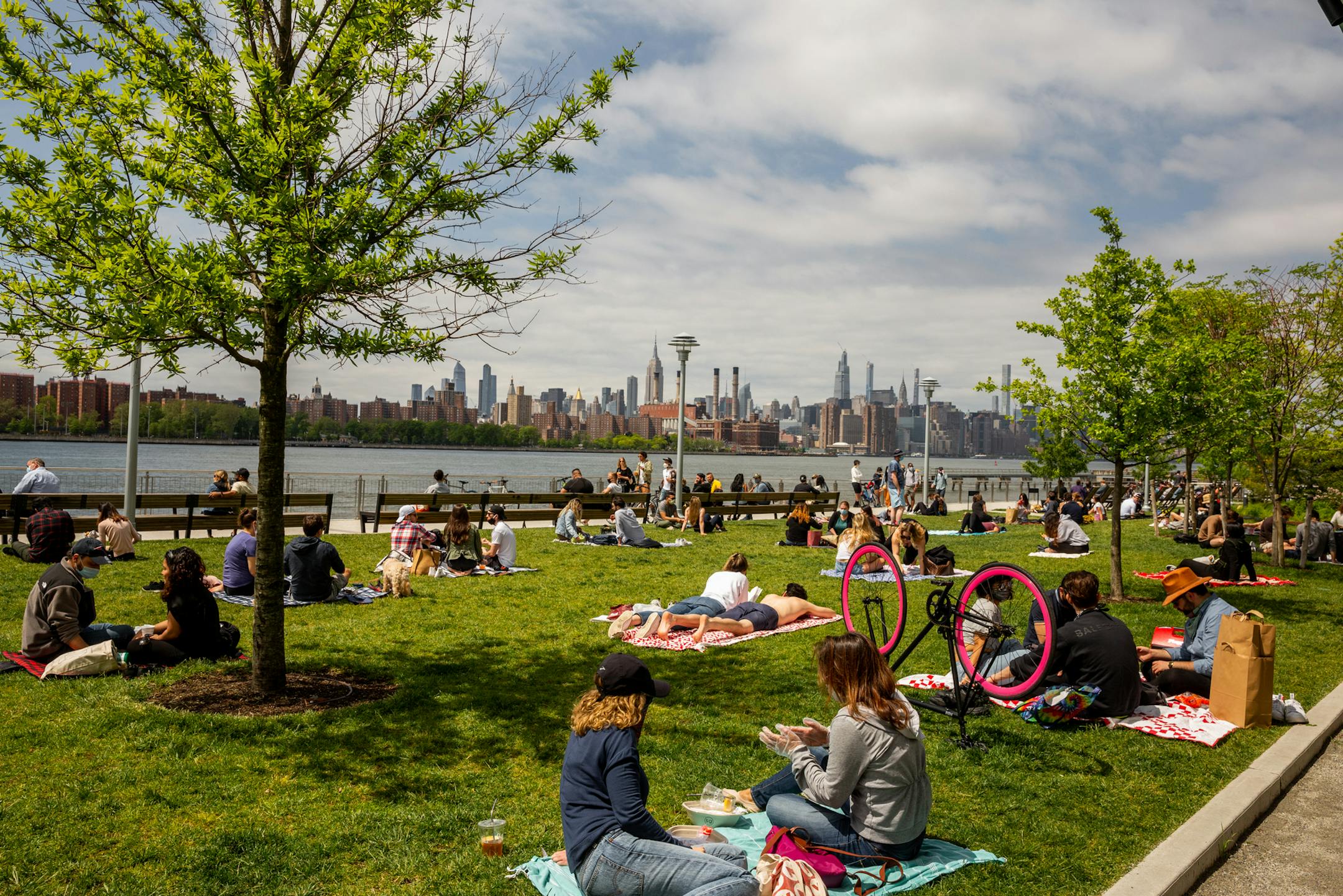 FILE -- People visit Domino Park in the Williamsburg neighborhood of Brooklyn, May 24, 2020. European Union officials are racing to agree on who can visit the bloc as of July 1 based on how countries of origin are faring with new coronavirus cases. Americans are to be excluded, according to draft lists seen by The New York Times. (Sarah Blesener/The New York Times)