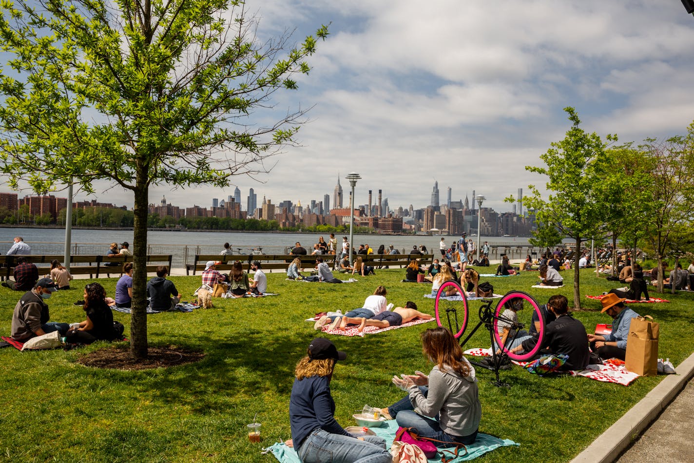 FILE -- People visit Domino Park in the Williamsburg neighborhood of Brooklyn, May 24, 2020. European Union officials are racing to agree on who can visit the bloc as of July 1 based on how countries of origin are faring with new coronavirus cases. Americans are to be excluded, according to draft lists seen by The New York Times. (Sarah Blesener/The New York Times)