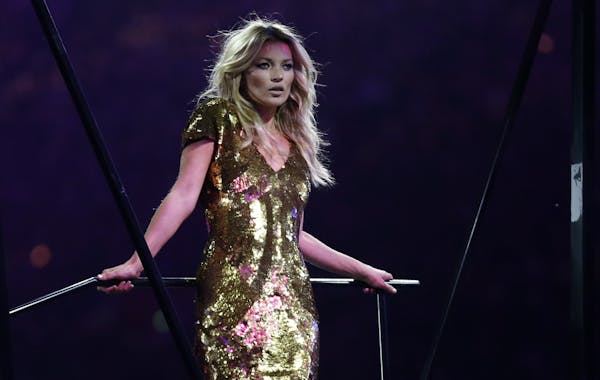 British model Kate Moss poses on stage during the Closing Ceremony at the 2012 Summer Olympics, Sunday, Aug. 12, 2012, in London.