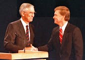 Sen. Lloyd Bentsen, left, D-IN, and Sen. Dan Quayle, R-TX, shake hands after their vice presidential debate in Omaha, Neb., Oct. 5, 1988. (AP Photo/Ro