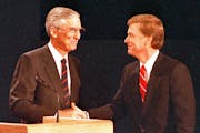 Sen. Lloyd Bentsen, left, D-IN, and Sen. Dan Quayle, R-TX, shake hands after their vice presidential debate in Omaha, Neb., Oct. 5, 1988. (AP Photo/Ro