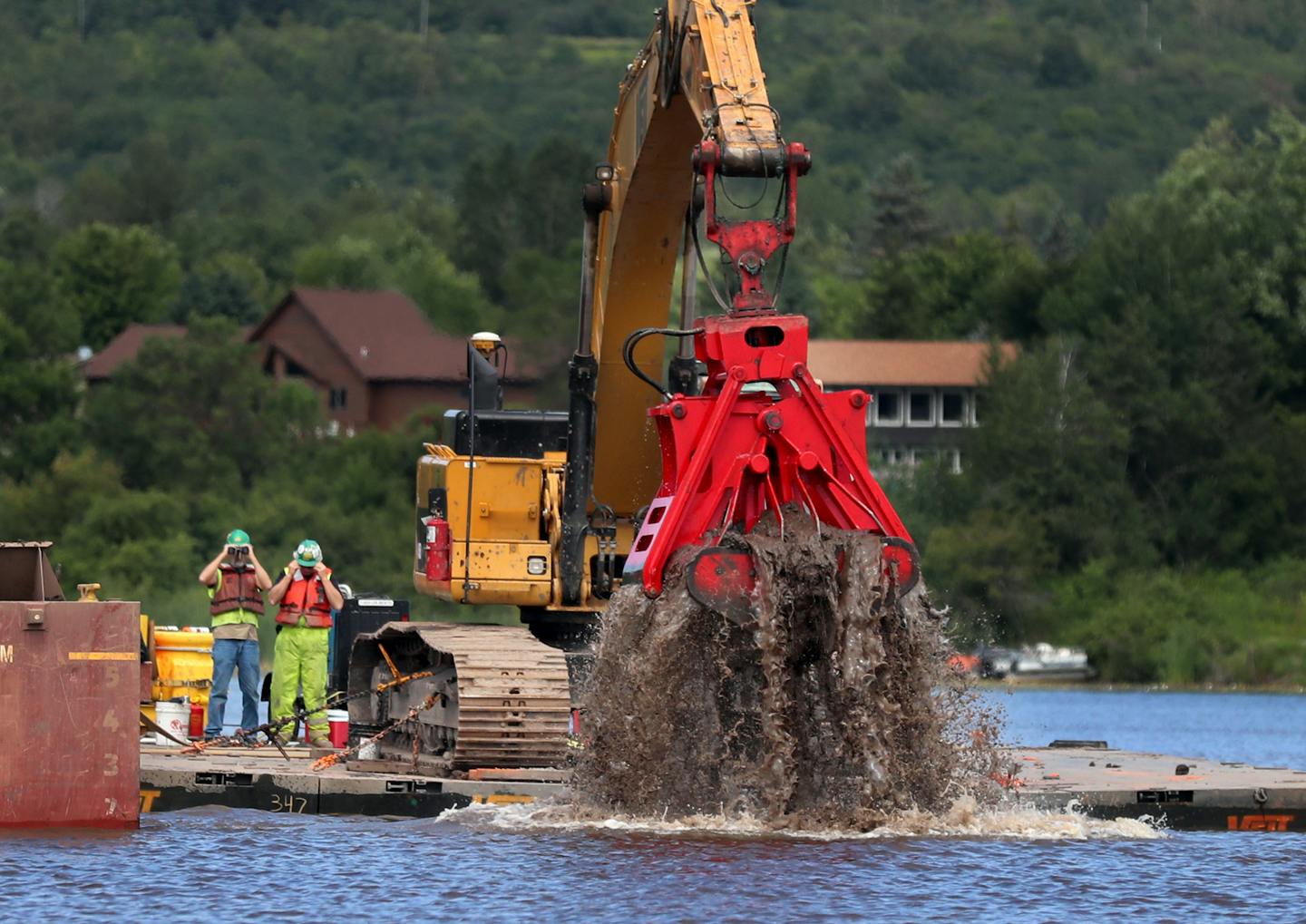 Crews hauled out sediment that built up near sawmills on the St. Louis River estuary, a nursery for many kinds of fish and birds.