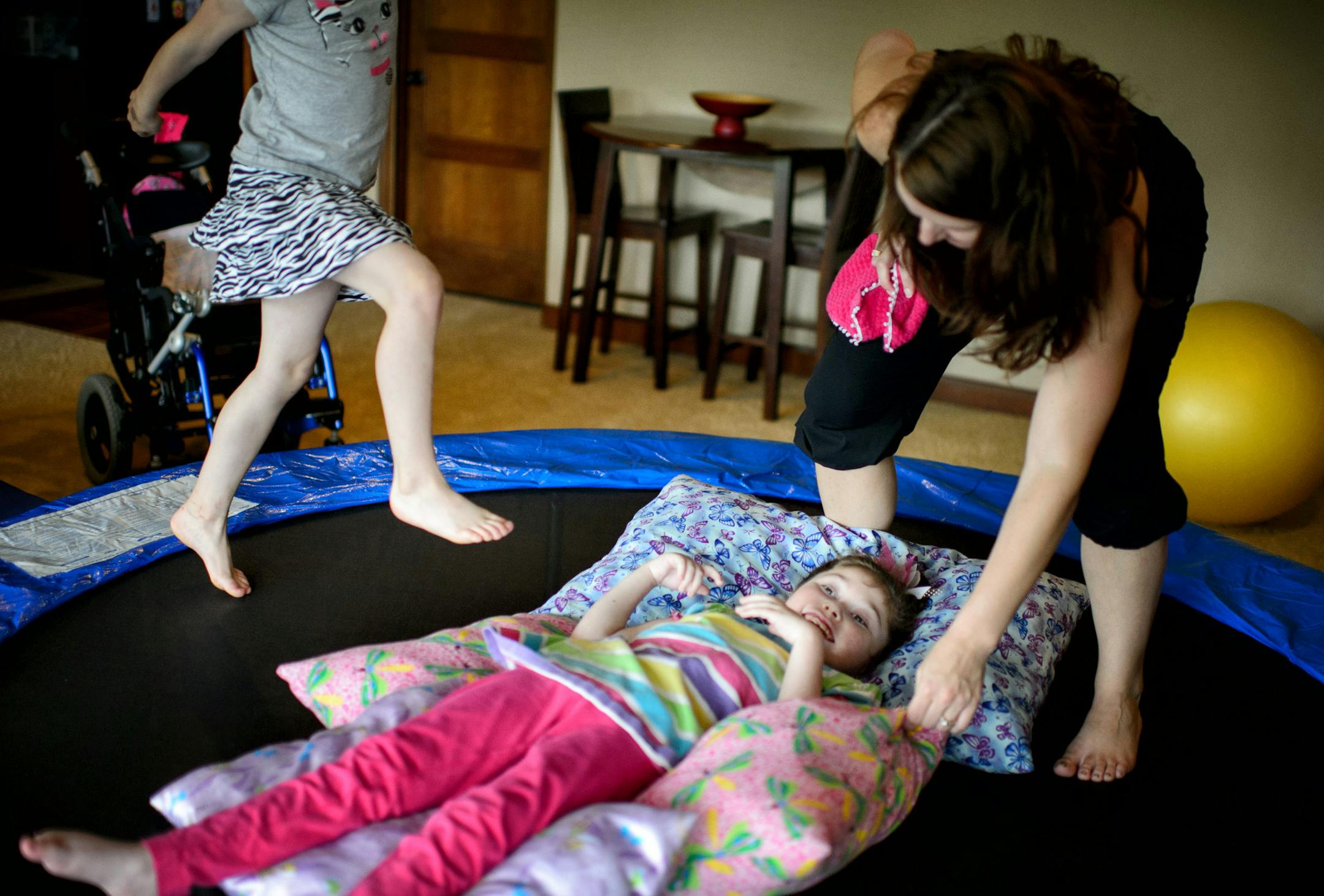 Emily laughed as her little sister Isabel, 6 bounced her on the trampoline. Kristy Kargel said she is keeping her fingers crossed that medical cannabis will help ease the almost constant seizures of her daughter Emily, 9, who has intractable epilepsy. Monday June 9, 2014 ] GLEN STUBBE * gstubbe@startribune.com