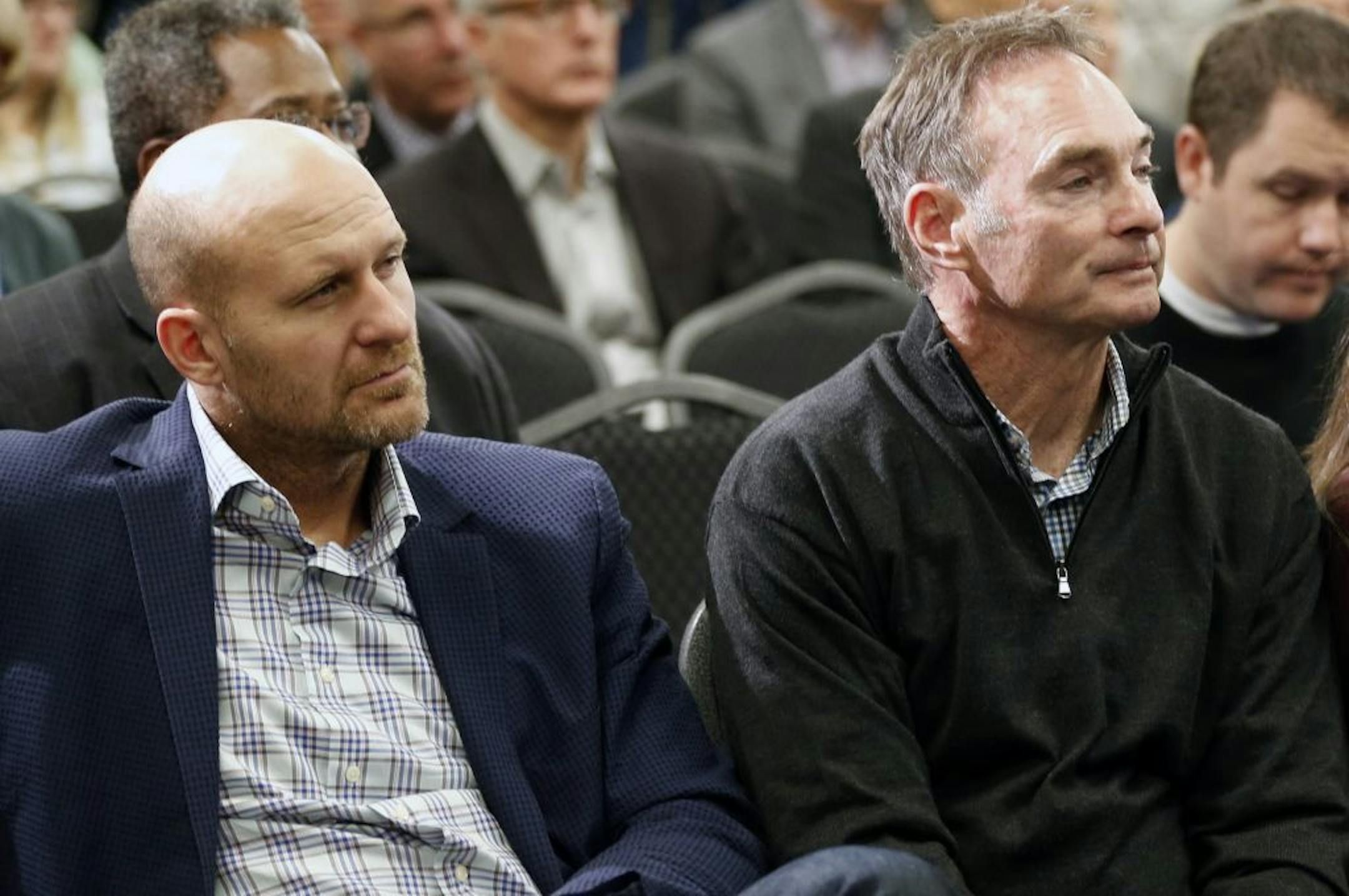 Minnesota Twins manager Paul Molitor, right, and former Twins player Corey Koskie listen at a news conference where new chief baseball officer Derek Falvey and new general manager Thad Levine were introduced in Minneapolis, Monday, Nov. 7, 2016.
