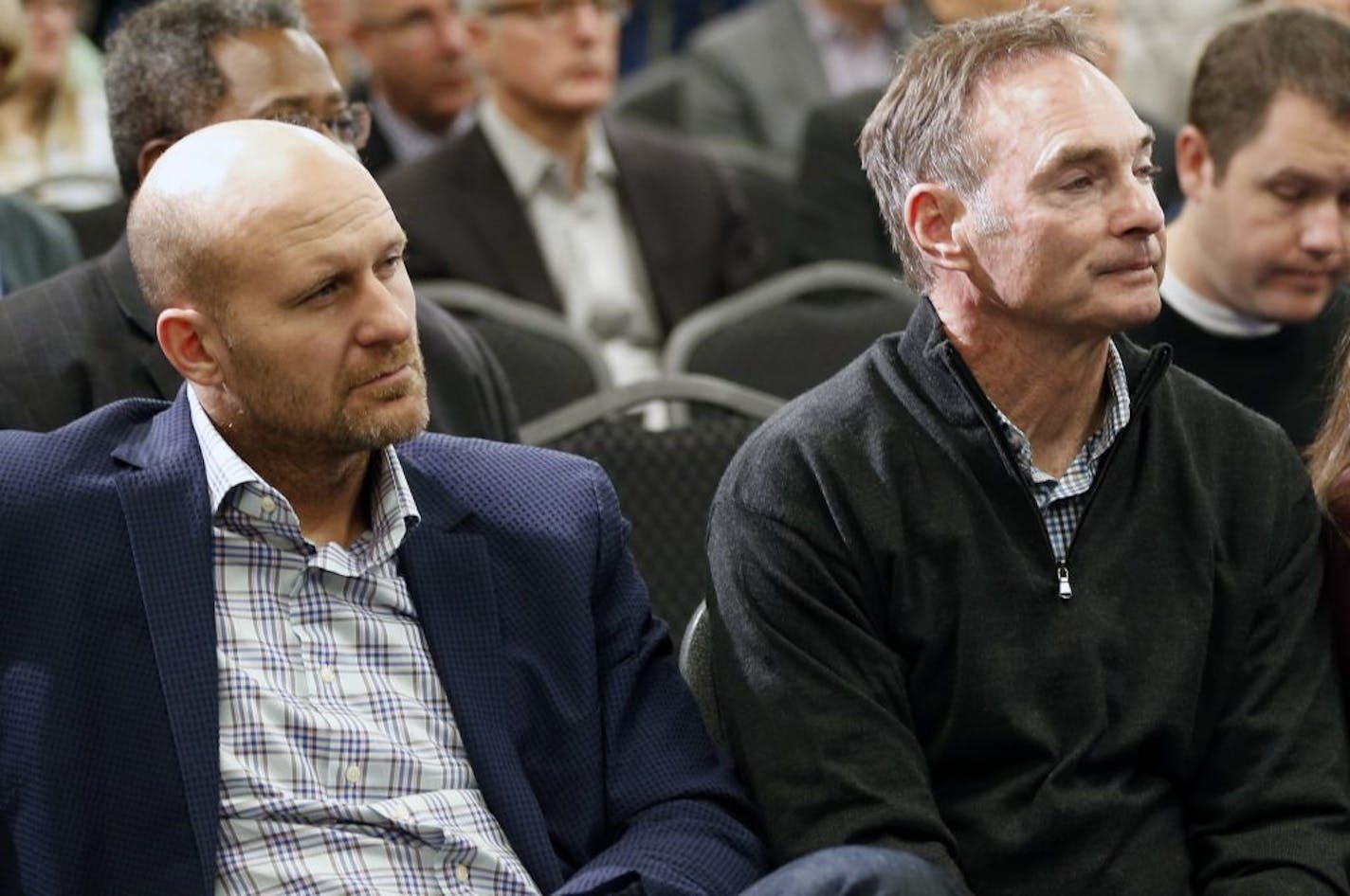 Minnesota Twins manager Paul Molitor, right, and former Twins player Corey Koskie listen at a news conference where new chief baseball officer Derek Falvey and new general manager Thad Levine were introduced in Minneapolis, Monday, Nov. 7, 2016.