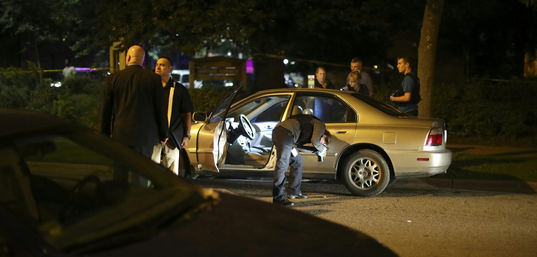 Investigators from the Minneapolis Police Department crime lab documented evidence around the car where a stabbing took place in Dinkytown Thursday night. ] JEFF WHEELER ï jeff.wheeler@startribune.com Investigators worked the scene where a fatal stabbing took place in Dinkytown Thursday night, August 25, 2016 on 13th Ave. SE at University Ave.
