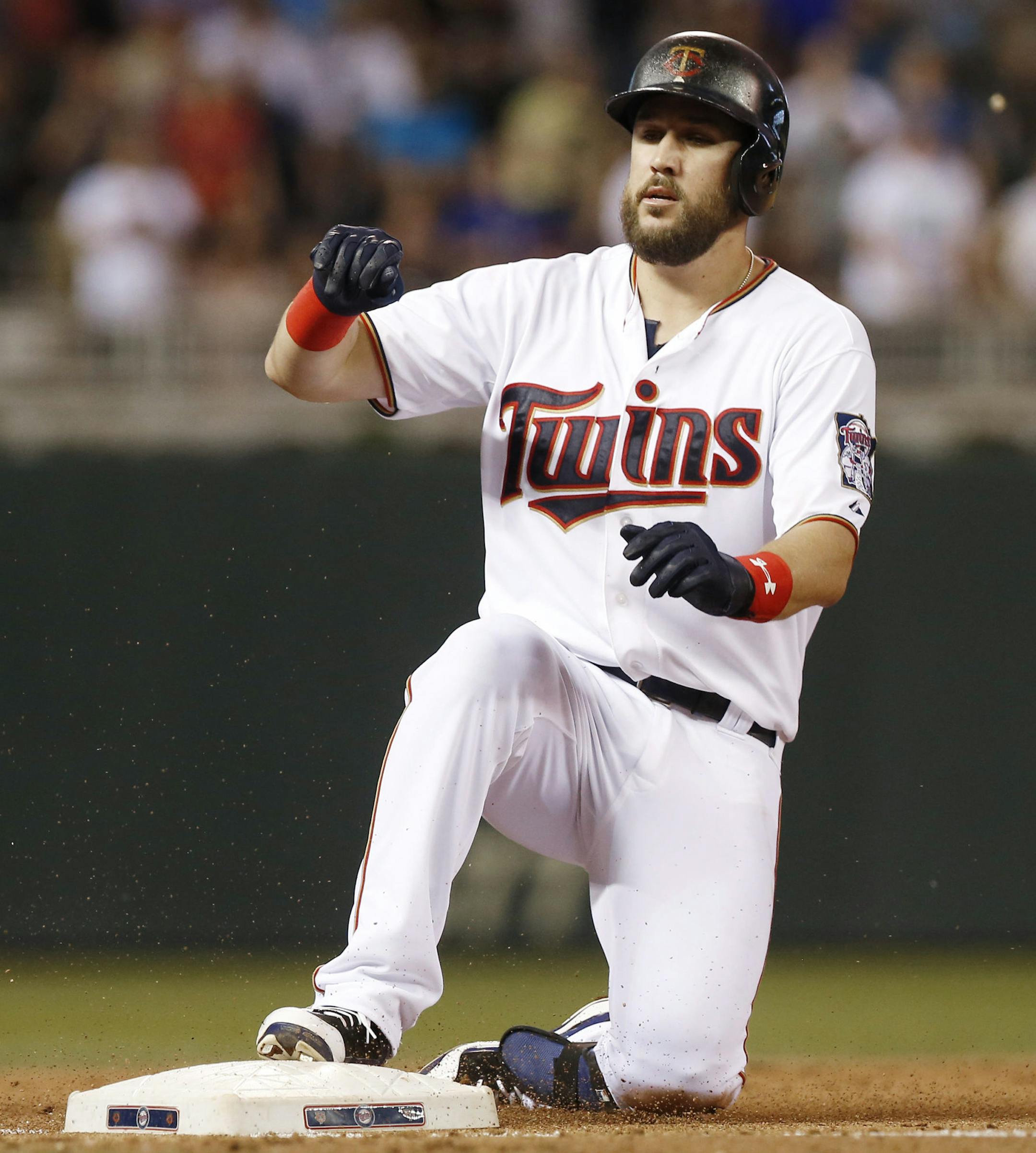 Minnesota Twins’ Trevor Plouffe arrives at third with a triple during the seventh inning of a baseball game, breaking up a no-hitter by Kansas City Royals pitcher Chris Young on Tuesday, June 9, 2015, in Minneapolis. The Royals won 2-0. (AP Photo/Jim Mone)