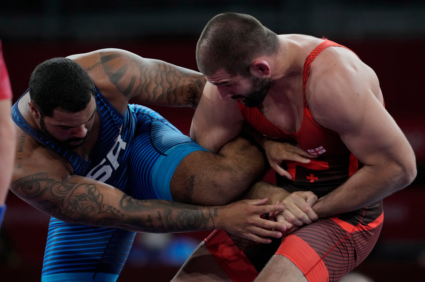 United State's Gable Dan Steveson, left, competes against Georgia's Gennadij Cudinovic during their men's freestyle 125kg wrestling final match at the 2020 Summer Olympics, Friday, Aug. 6, 2021, in Chiba, Japan. (AP Photo/Aaron Favila) ORG XMIT: MER7732a4ec246898c84d5df6b4d04a4