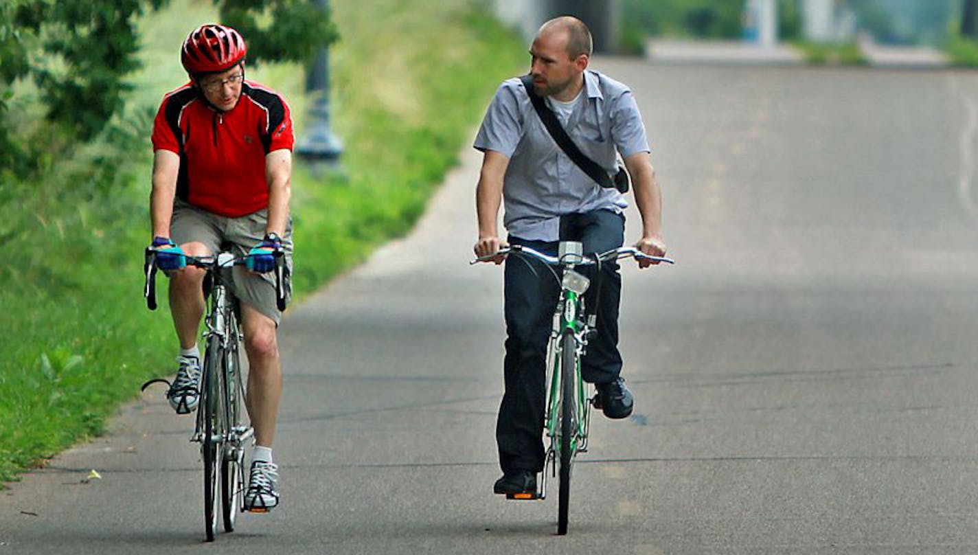 Minneapolis bike and pedestrian coordinator Shaun Murphy, right, took traffic engineer Allan Klugman for a ride along the Greenway.